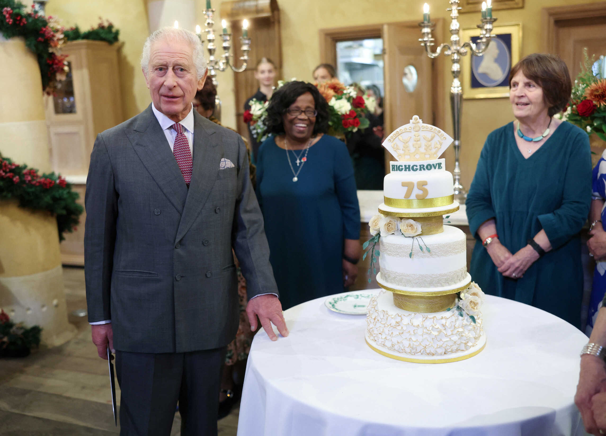 King Charles III poses with his cake as he attends his 75th birthday party hosted by the Prince's Foundation at Highgrove House on November 13, 2023 in Tetbury, England. Guests include local residents who have been nominated by friends and family and individuals and organisations also turning 75 in 2023.     Chris Jackson