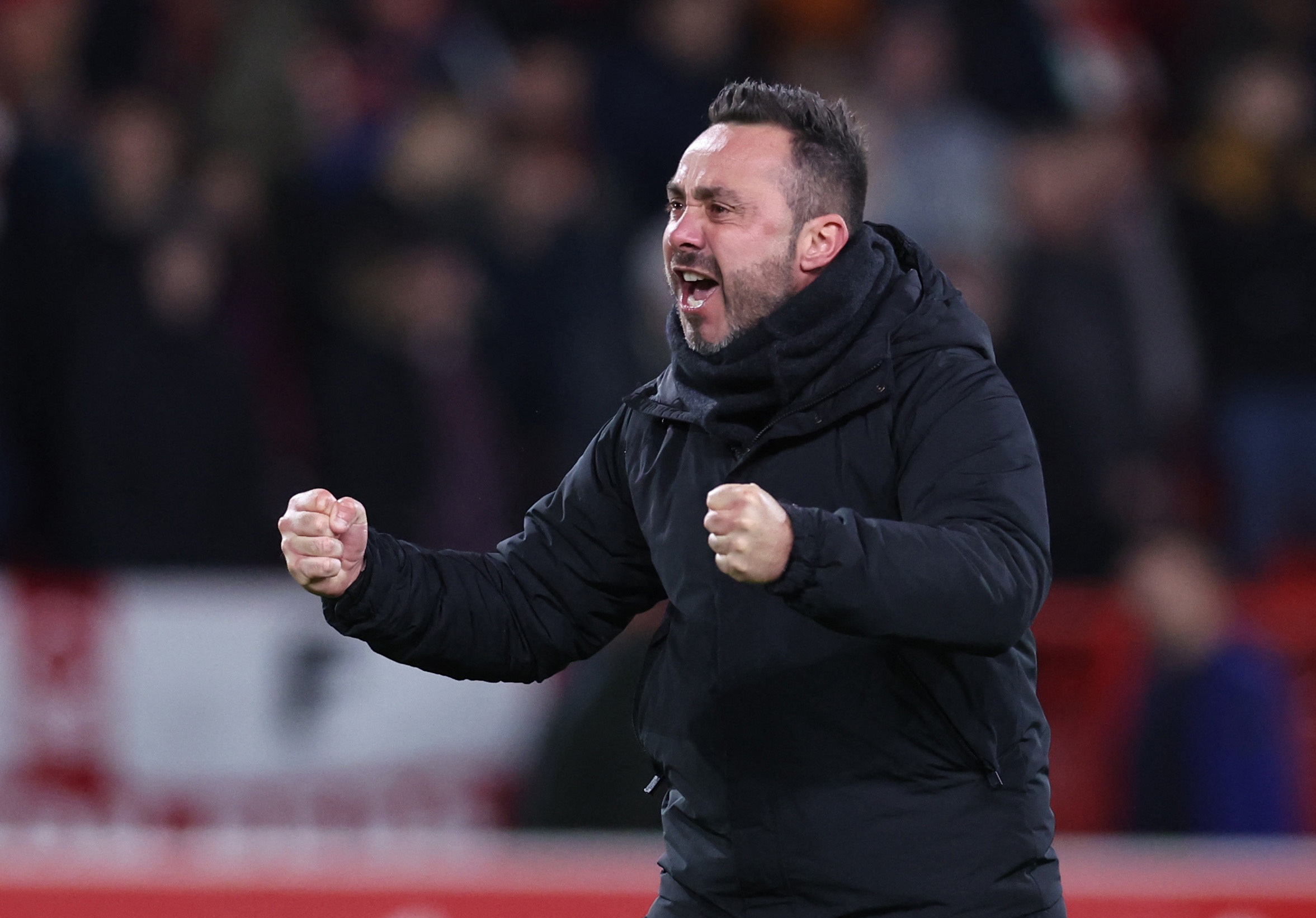 Soccer Football - Premier League - Nottingham Forest v Brighton & Hove Albion - The City Ground, Nottingham, Britain - November 25, 2023 Brighton & Hove Albion manager Roberto De Zerbi celebrates after the match REUTERS
