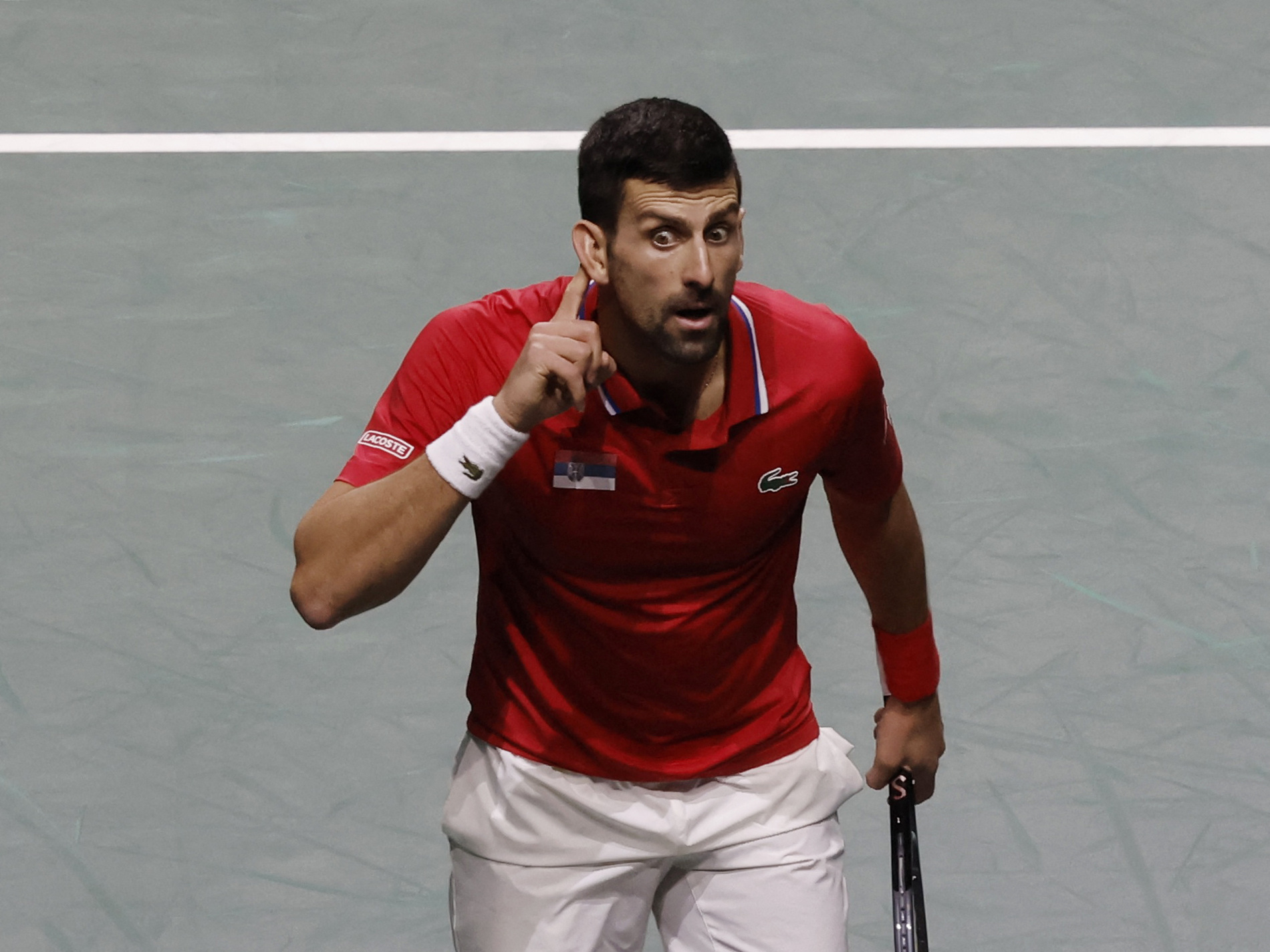 Tennis - Davis Cup - Finals - Serbia v Britain - Palacio de deportes Martin Carpena, Malaga, Spain - November 23, 2023 Serbia's Novak Djokovic reacts during his match in the quarter final against Britain's Cameron Norrie REUTERS