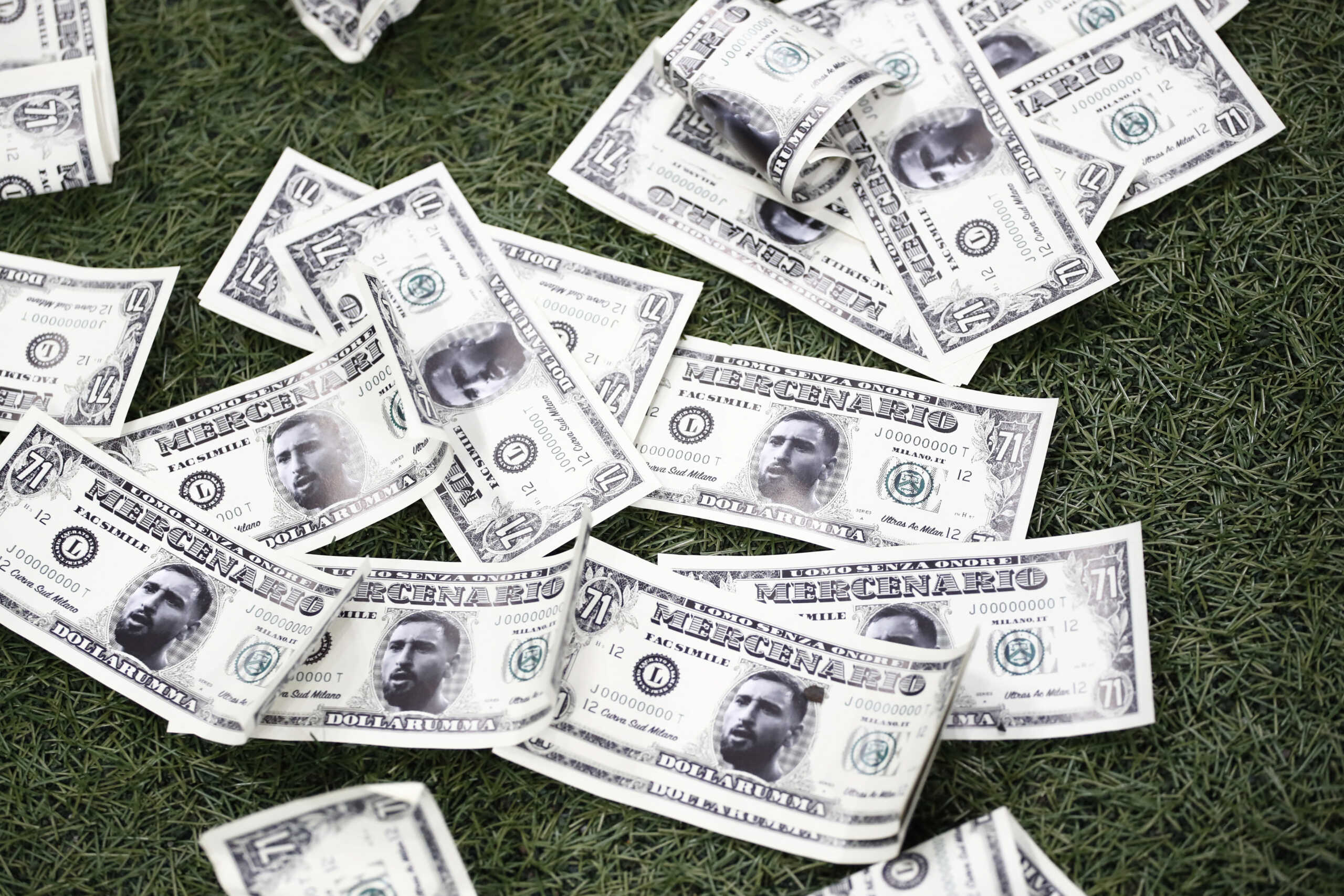 Soccer Football - Champions League - Group F - AC Milan v Paris St Germain - San Siro, Milan, Italy - November 7, 2023 General view as fake cash notes with former AC Milan player and Paris St Germain's Gianluigi Donnarumma's face on it are seen before the match REUTERS