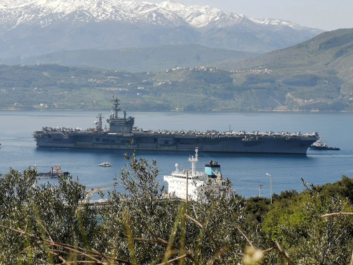 epa09085423 The nuclear-powered aircraft carrier USS Eisenhower arrived at the naval base of Marathi, Crete, Greece, 20 March 2021. The US aircraft carrier has a 5,600 crew members and can carry 90 fighter jets and helicopters.  EPA