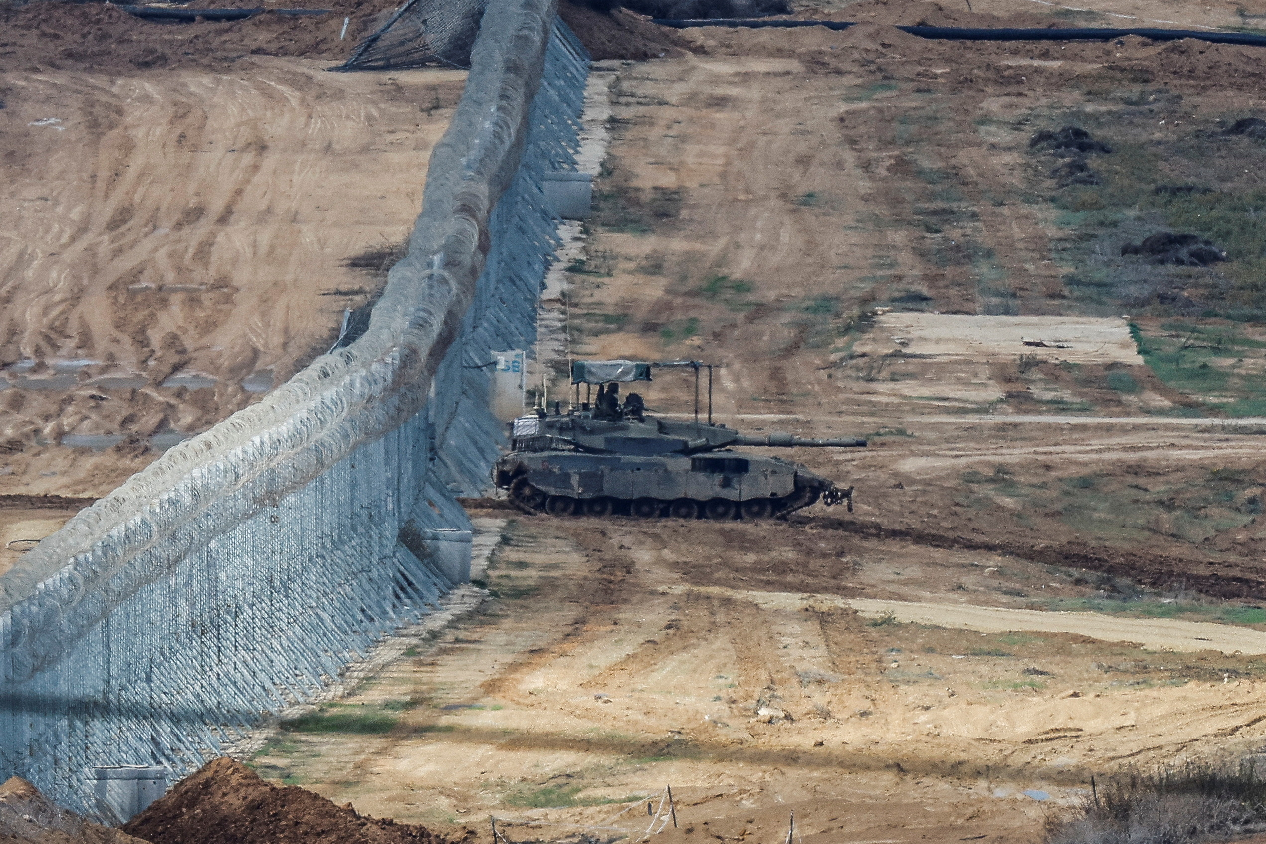 An Israeli Merkava tank manoeuvres near the Israel-Gaza border, amid the temporary truce between Hamas and Israel, as seen from southern Israel, November 28, 2023. REUTERS
