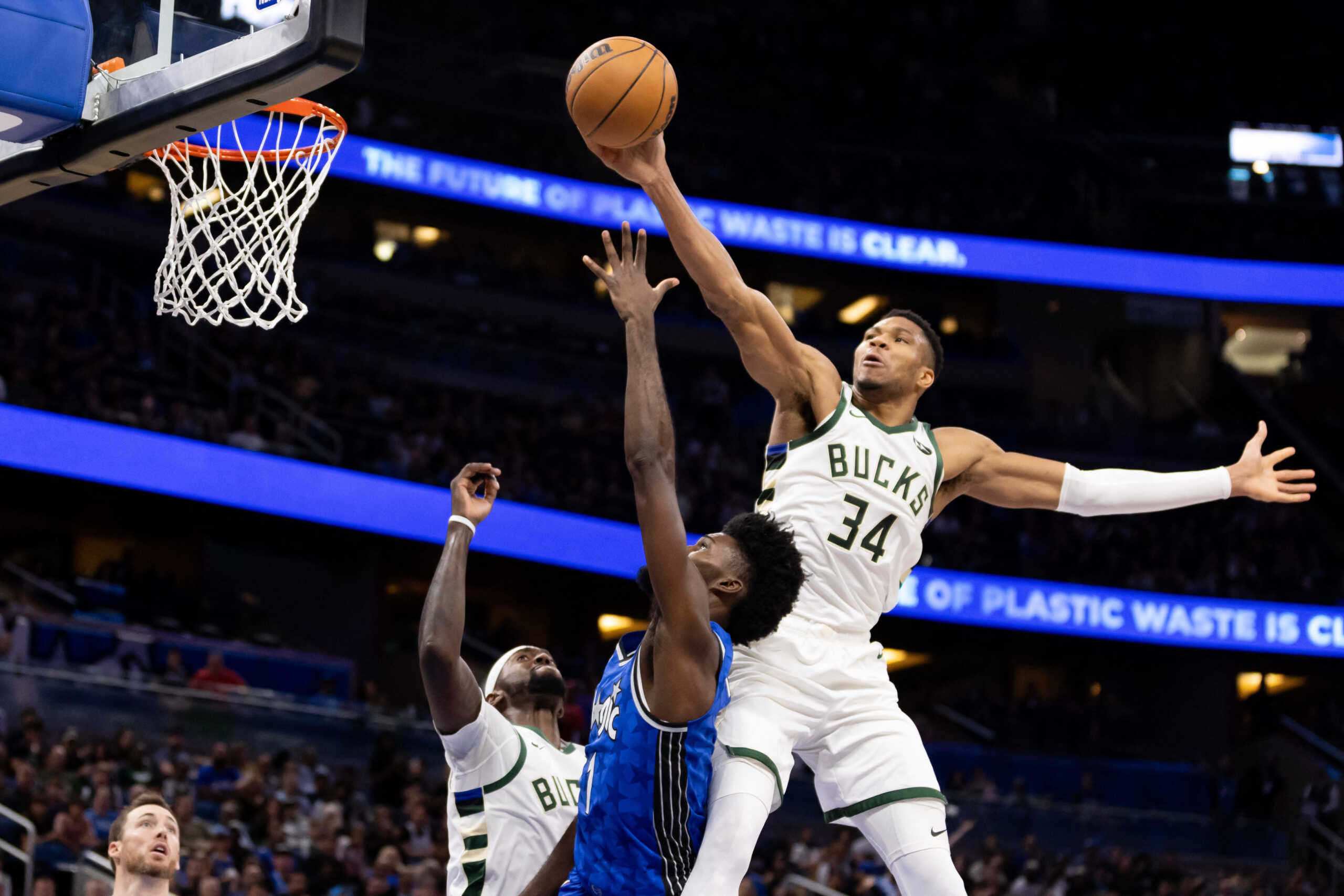 Nov 11, 2023; Orlando, Florida, USA; Milwaukee Bucks forward Giannis Antetokounmpo (34) blocks the shot from Orlando Magic forward Jonathan Isaac (1) during the first half at Amway Center. Mandatory Credit: Matt Pendleton-USA TODAY Sports