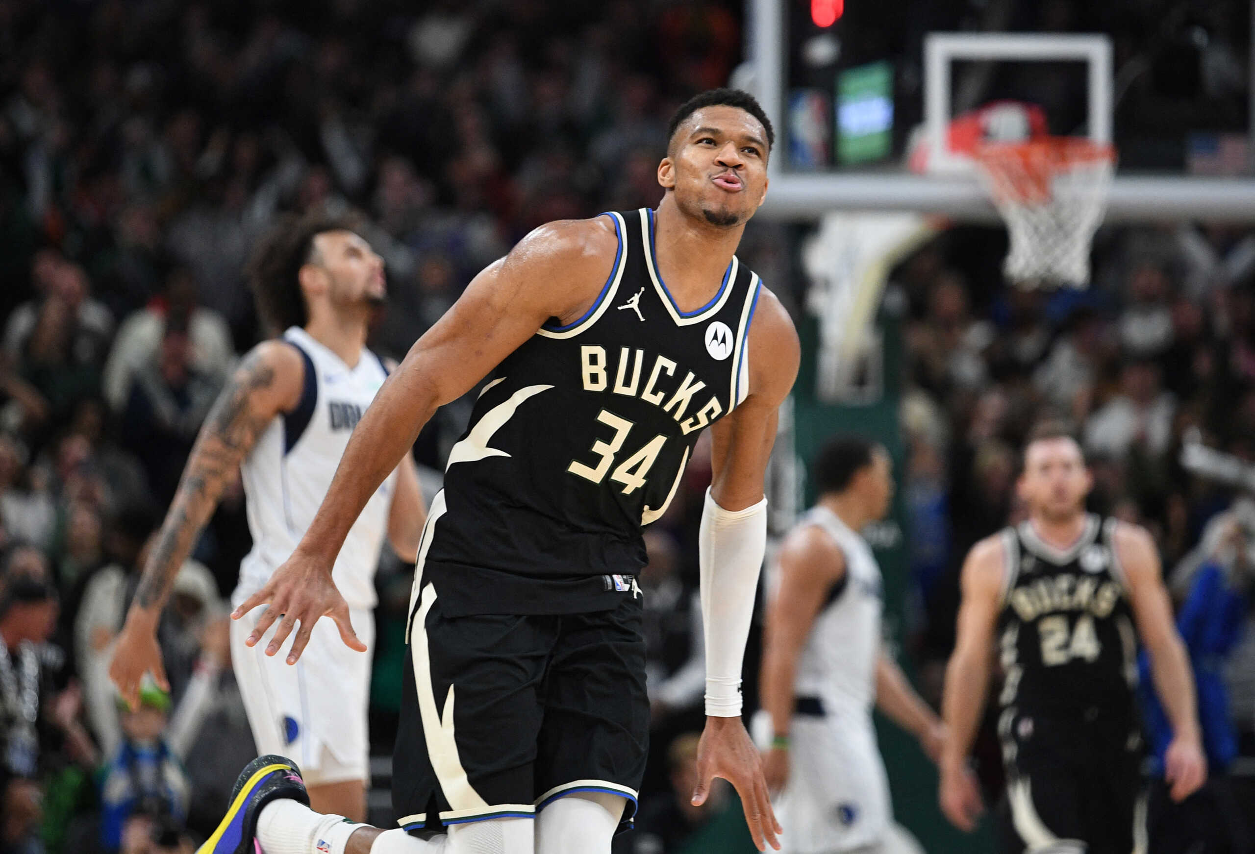 Nov 18, 2023; Milwaukee, Wisconsin, USA; Milwaukee Bucks forward Giannis Antetokounmpo (34) celebrates a made basket in the closing minute of their victory over the Dallas Mavericks at Fiserv Forum. Mandatory Credit: Michael McLoone-USA TODAY Sports