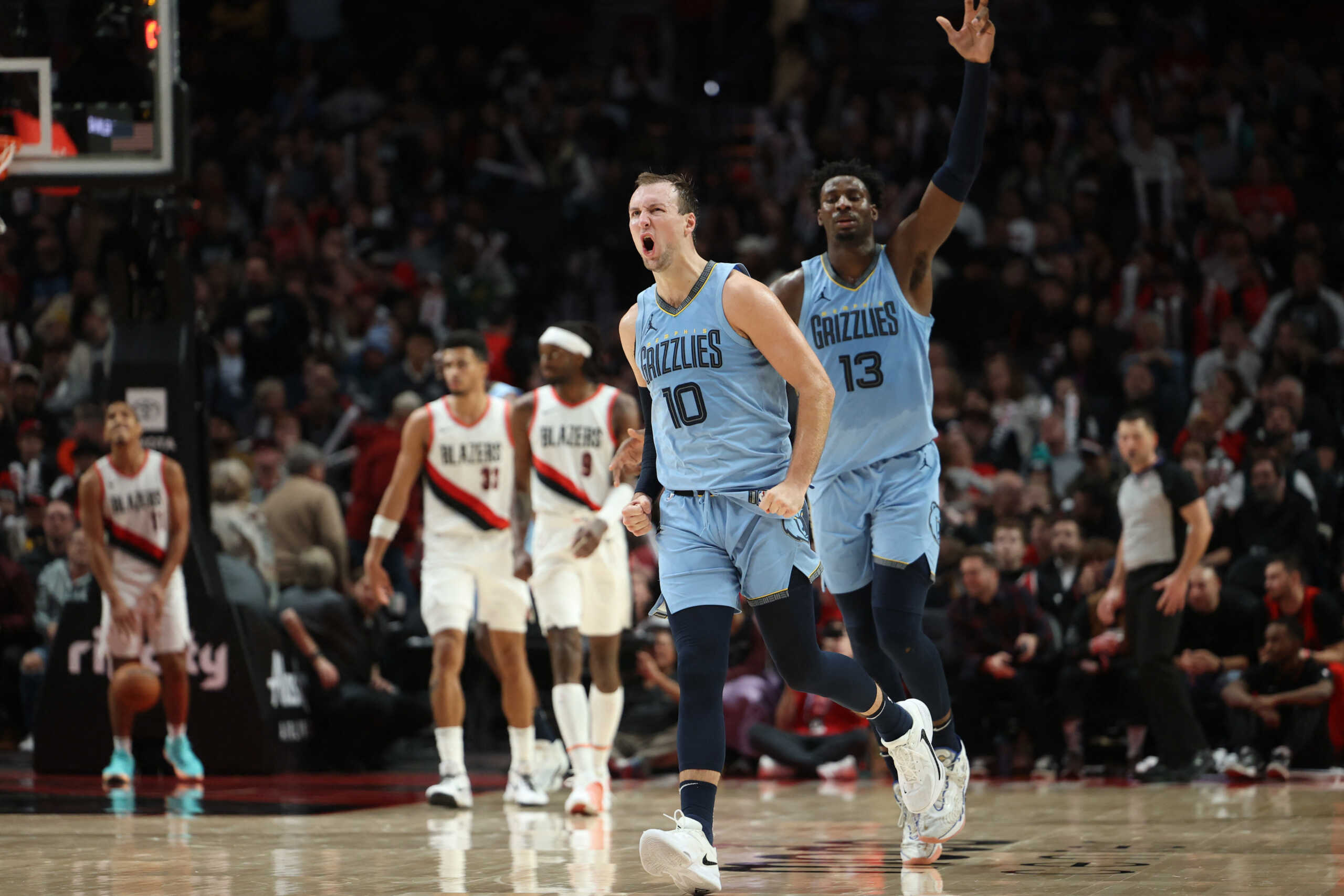 Nov 5, 2023; Portland, Oregon, USA; Memphis Grizzlies guard Luke Kennard (10) reacts after making a three point shot against the Portland Trail Blazers in the second half at Moda Center. Mandatory Credit: Jaime Valdez-USA TODAY Sports