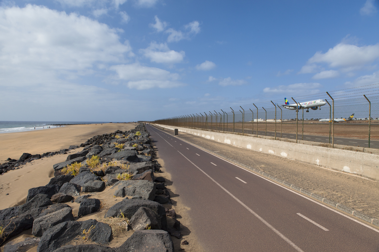 Lanzarote airport, Spain - August 31, 2018: Airplane landing in the international airport of Lanzarote (Arrecife), Canary Islands, Spain. This airport is very close to atlantic ocean.