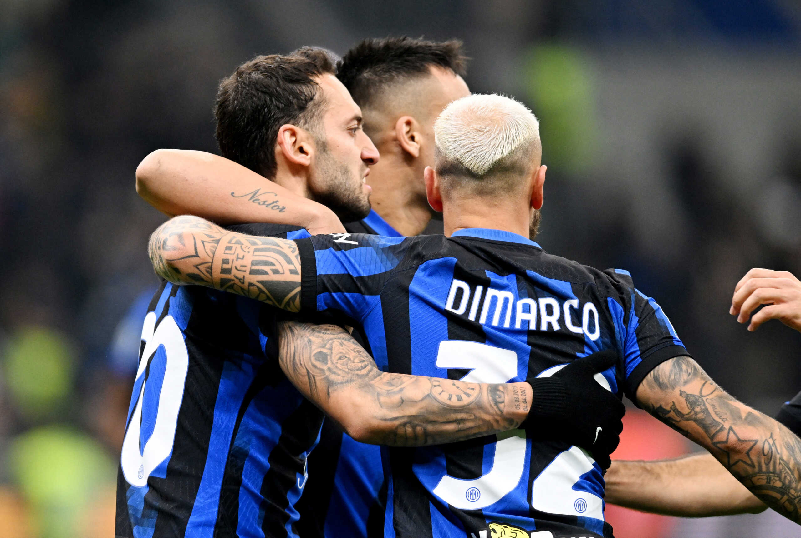 Soccer Football - Serie A - Inter Milan v Frosinone - San Siro, Milan, Italy - November 12, 2023 Inter Milan's Hakan Calhanoglu celebrates scoring their second goal with Lautaro Martinez and Federico Dimarco REUTERS