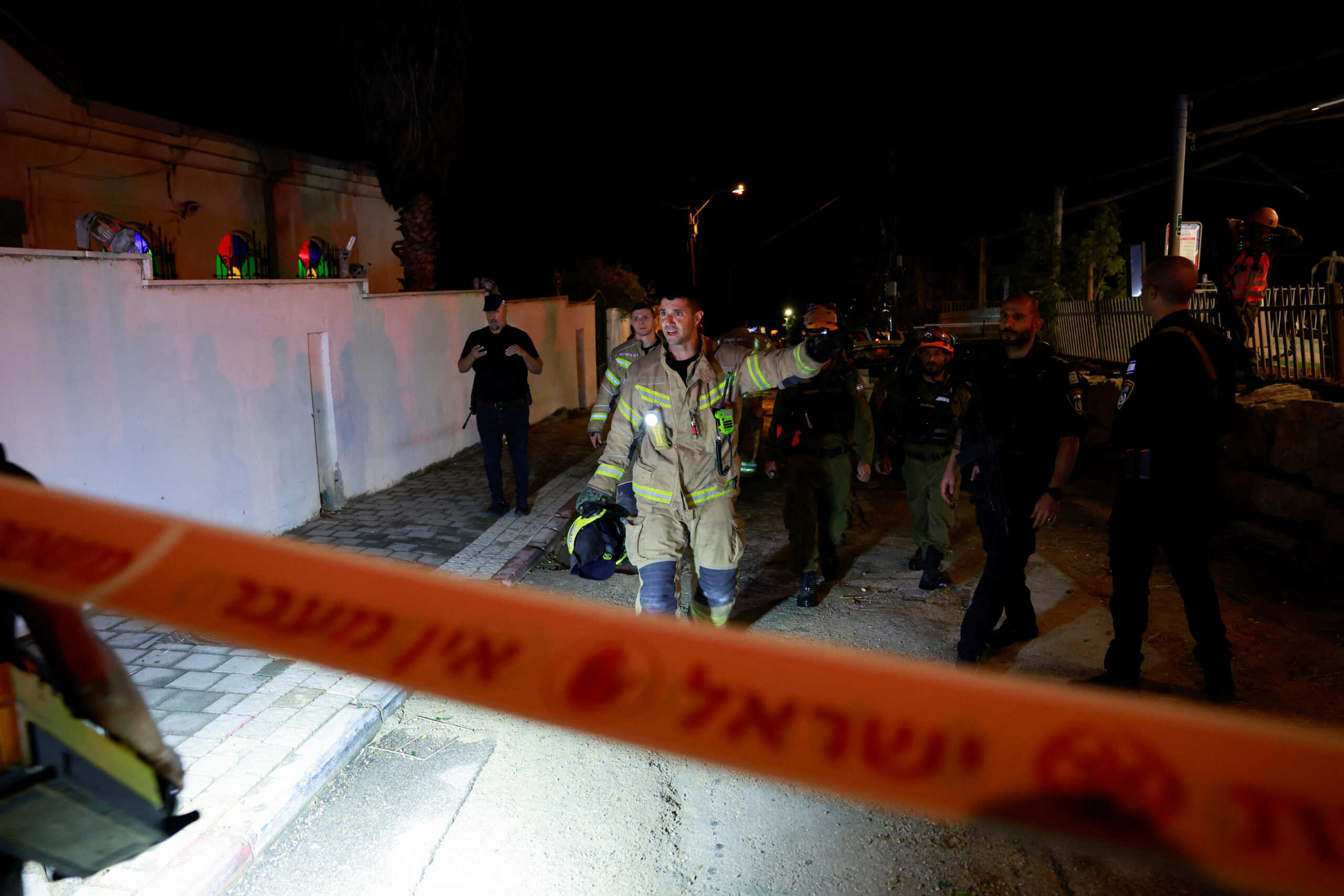 Israeli first responders check a damaged area from a rocket strike from Gaza, as fighting continues between the Palestinian militant group Hamas and Israel, in Jaffa, near Tel Aviv, Israel November 14, 2023. REUTERS