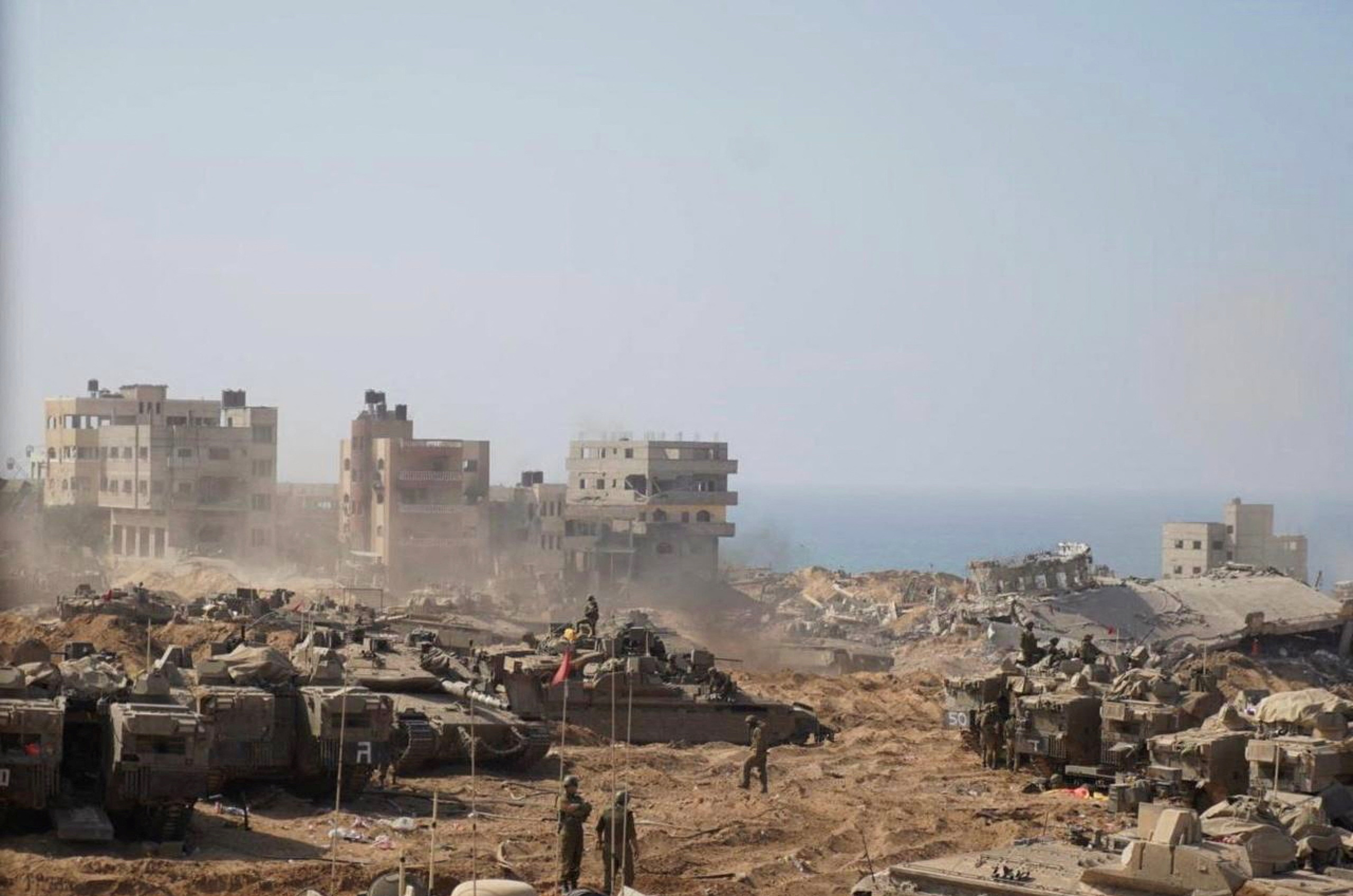 Israeli soldiers and tanks take position inside the Gaza Strip, according to the Israeli Defense Forces (IDF), in this handout picture obtained by Reuters on November 5, 2023. IDF