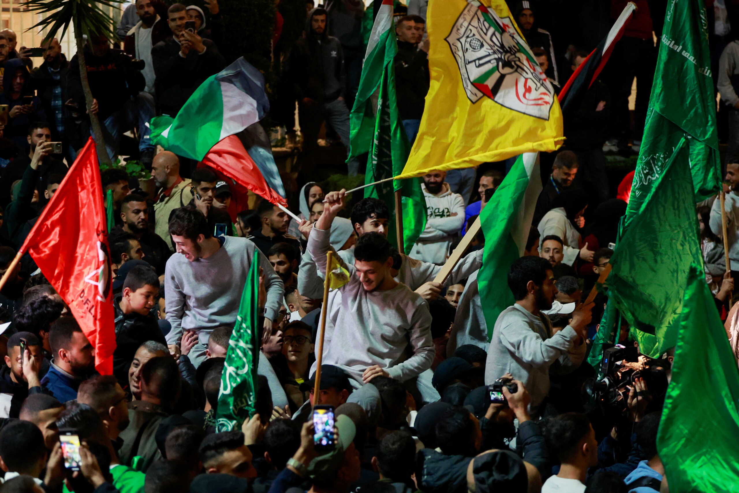Released Palestinian prisoners react after leaving the Israeli military prison, Ofer, amid a hostages-prisoners swap deal between Hamas and Israel, near Ramallah in the Israeli-occupied West Bank November 26, 2023. REUTERS