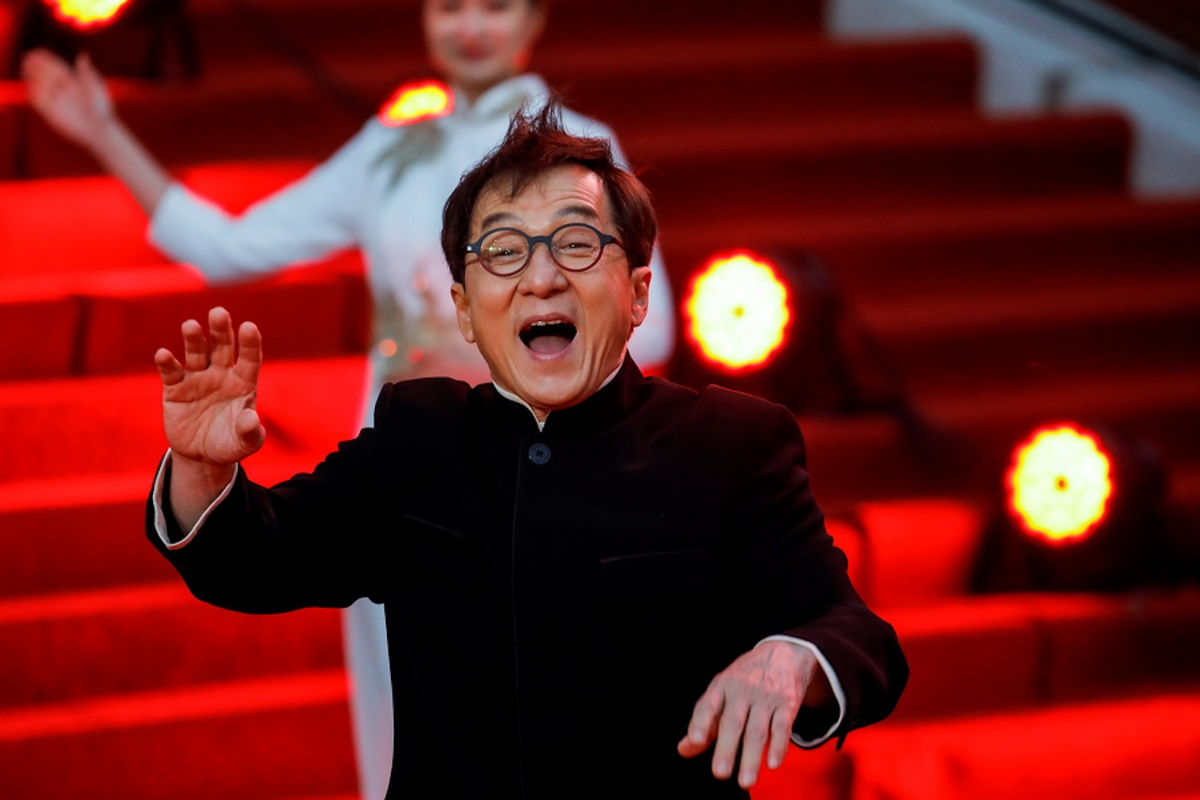 epa10584206 Chinese actor Jackie Chan waves as he arrives on the red carpet for the opening ceremony of the 13th Beijing International Film Festival (BJIFF), in Beijing, China, 24 March 2023. The film festival runs from 22 to 29 April 2023.  EPA
