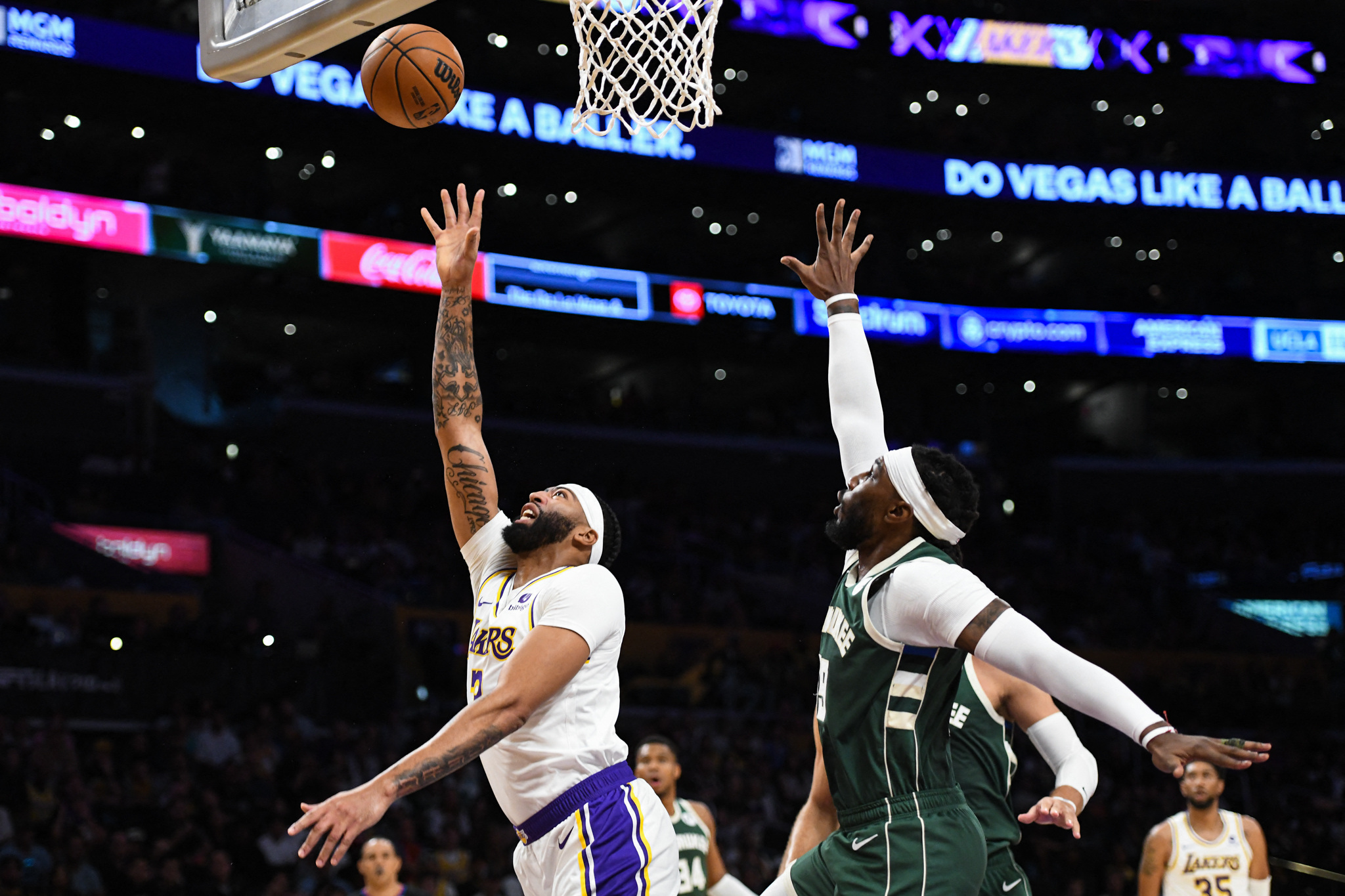 Oct 15, 2023; Los Angeles, California, USA; Los Angeles Lakers forward Anthony Davis (3) shoots a layup against Milwaukee Bucks forward Jae Crowder (99) in the first quarter at Crypto.com Arena. Mandatory Credit: Jonathan Hui-USA TODAY Sports