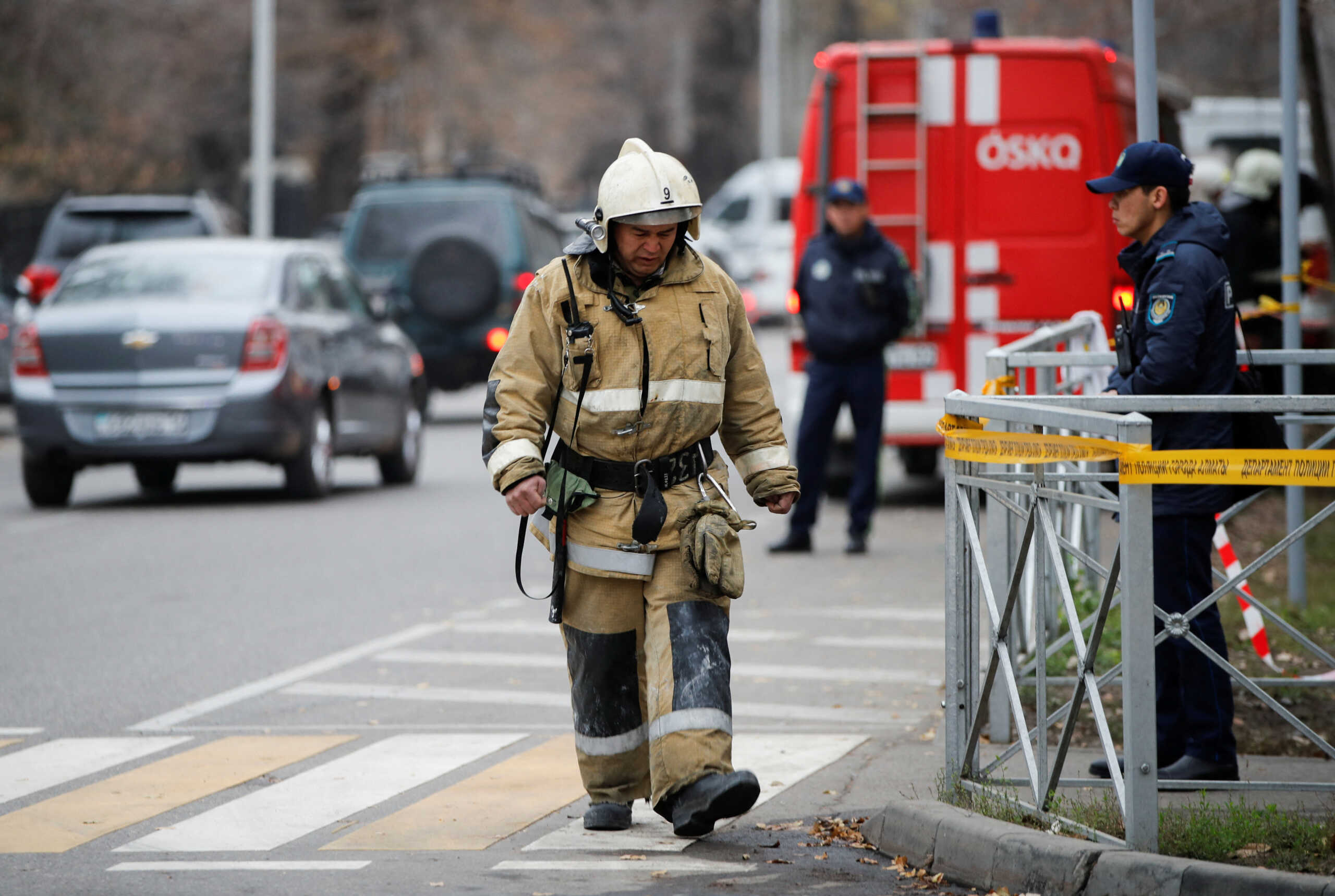 Emergency specialists work at the site of a fire at a hostel in Almaty, Kazakhstan, November 30, 2023. REUTERS