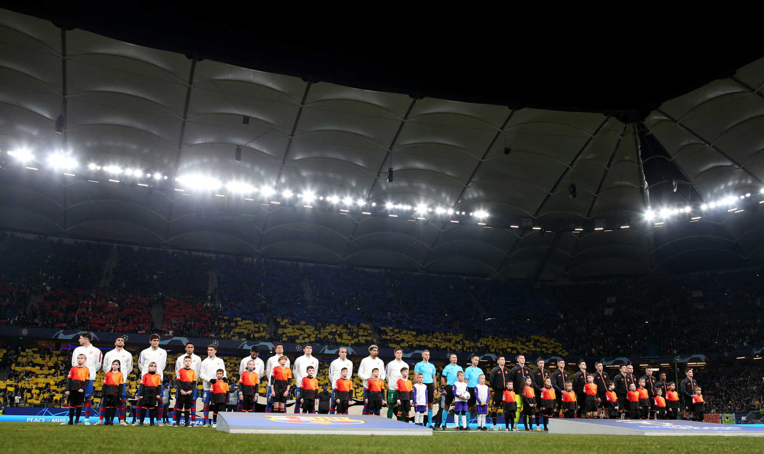 Soccer Football - Champions League - Group H - Shakhtar Donetsk v FC Barcelona - Volksparkstadion, Hamburg, Germany - November 7, 2023 Players and referees line up during the national anthems before the match REUTERS