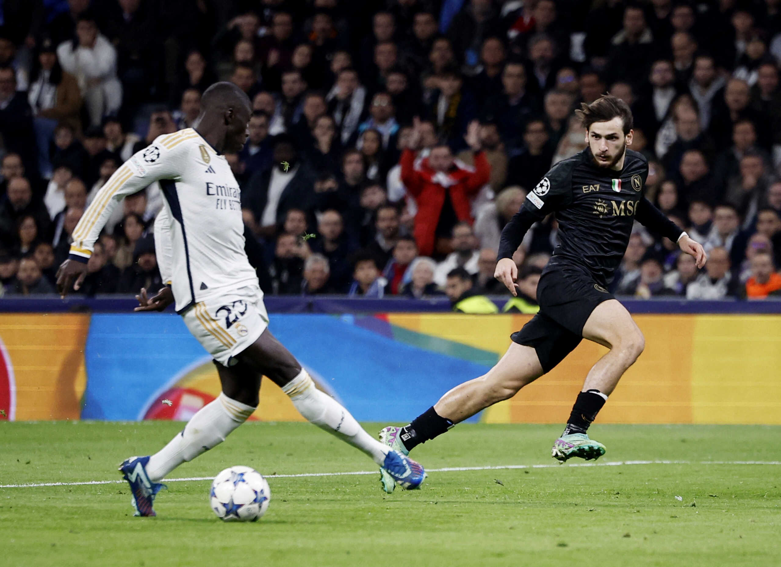 Soccer Football - Champions League - Group C - Real Madrid v Napoli - Santiago Bernabeu, Madrid, Spain - November 29, 2023 Napoli's Khvicha Kvaratskhelia in action with Real Madrid's Ferland Mendy REUTERS