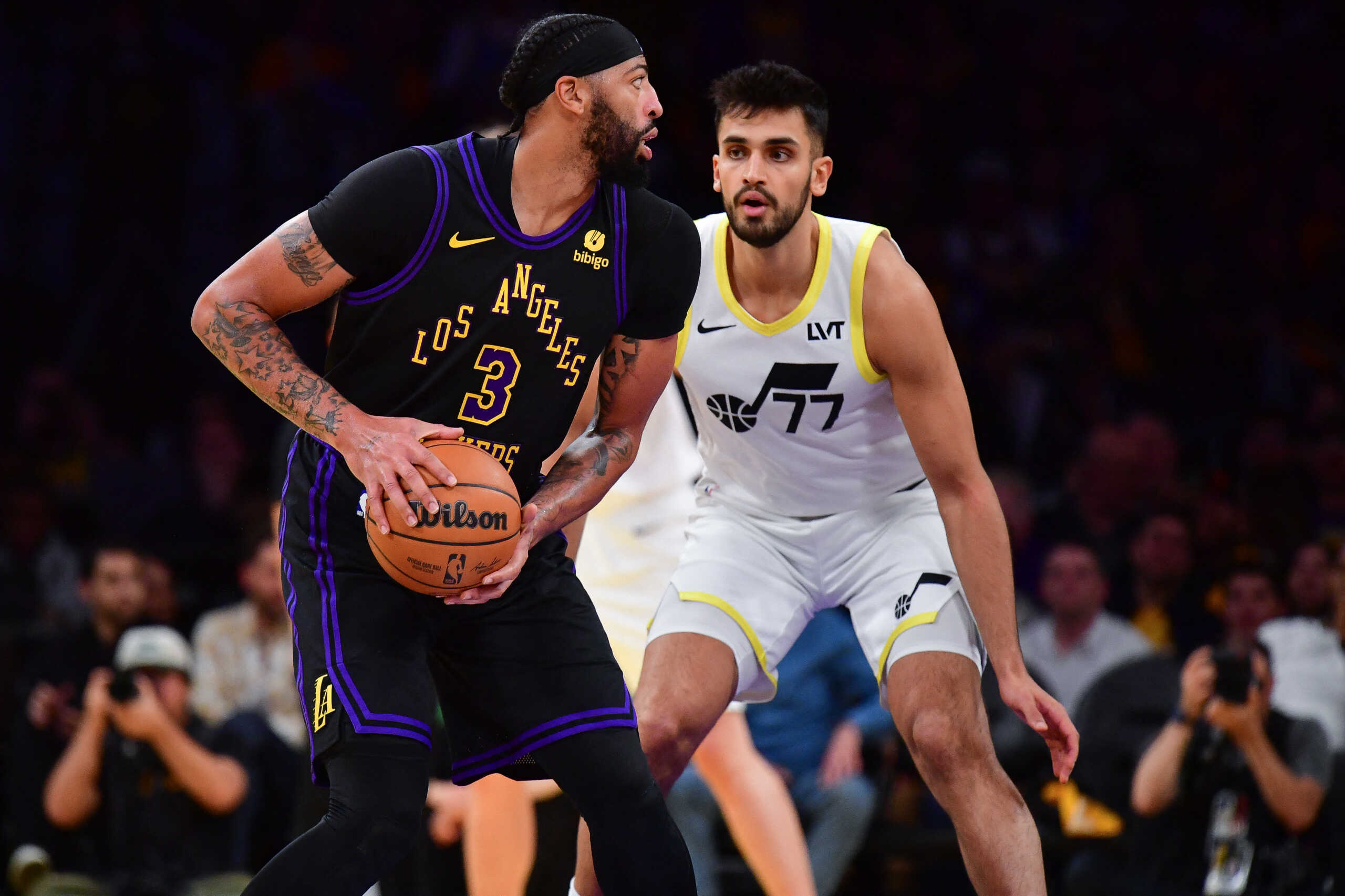 Nov 21, 2023; Los Angeles, California, USA; Los Angeles Lakers forward Anthony Davis (3) moves the ball against Utah Jazz center Omer Yurtseven (77) during the second half at Crypto.com Arena. Mandatory Credit: Gary A. Vasquez-USA TODAY Sports