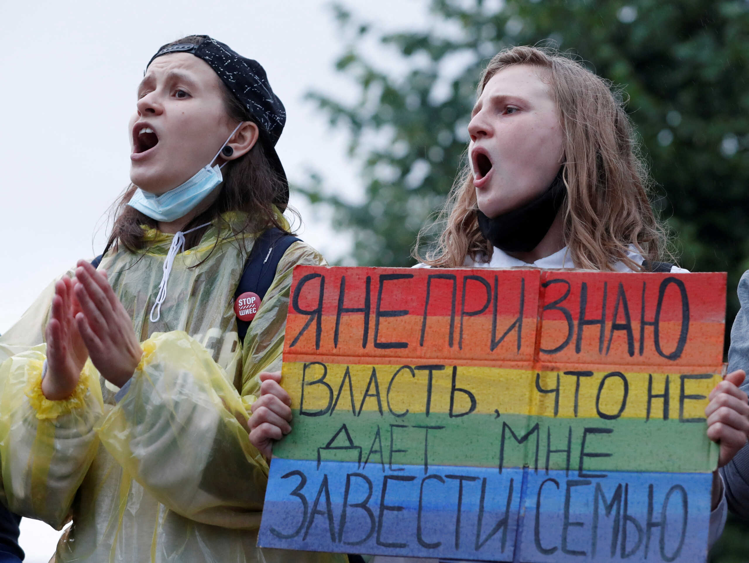FILE PHOTO: LGBT activists take part in a protest against amendments to Russia's Constitution and the results of a nationwide vote on constitutional reforms, in Moscow, Russia July 15, 2020. The placard reads: "I don't recognise the authority that keeps me from having a family". REUTERS