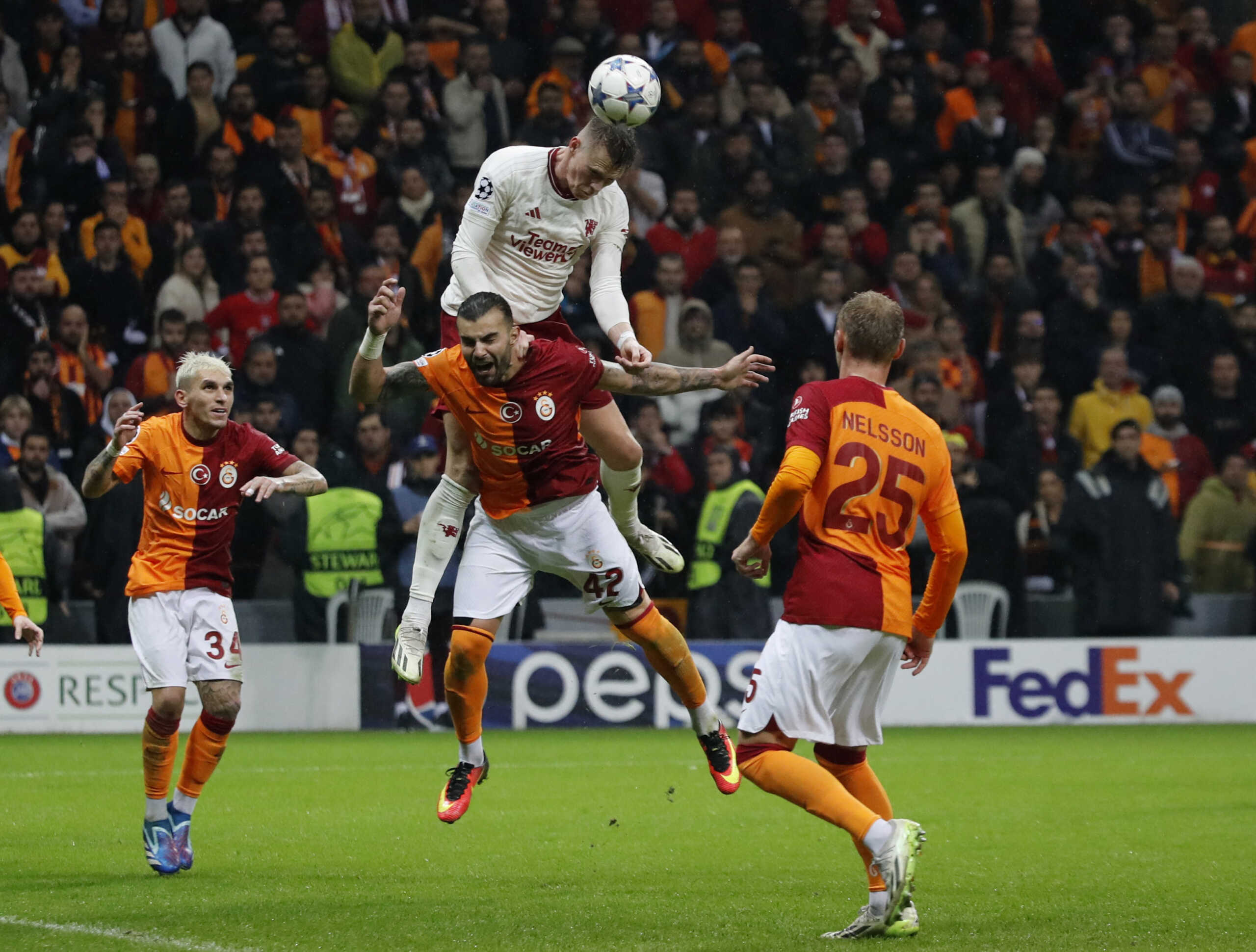Soccer Football - Champions League - Group A - Galatasaray v Manchester United - RAMS Park, Istanbul, Turkey - November 29, 2023 Manchester United's Scott McTominay in action with Galatasaray's Abdulkerim Bardakci REUTERS