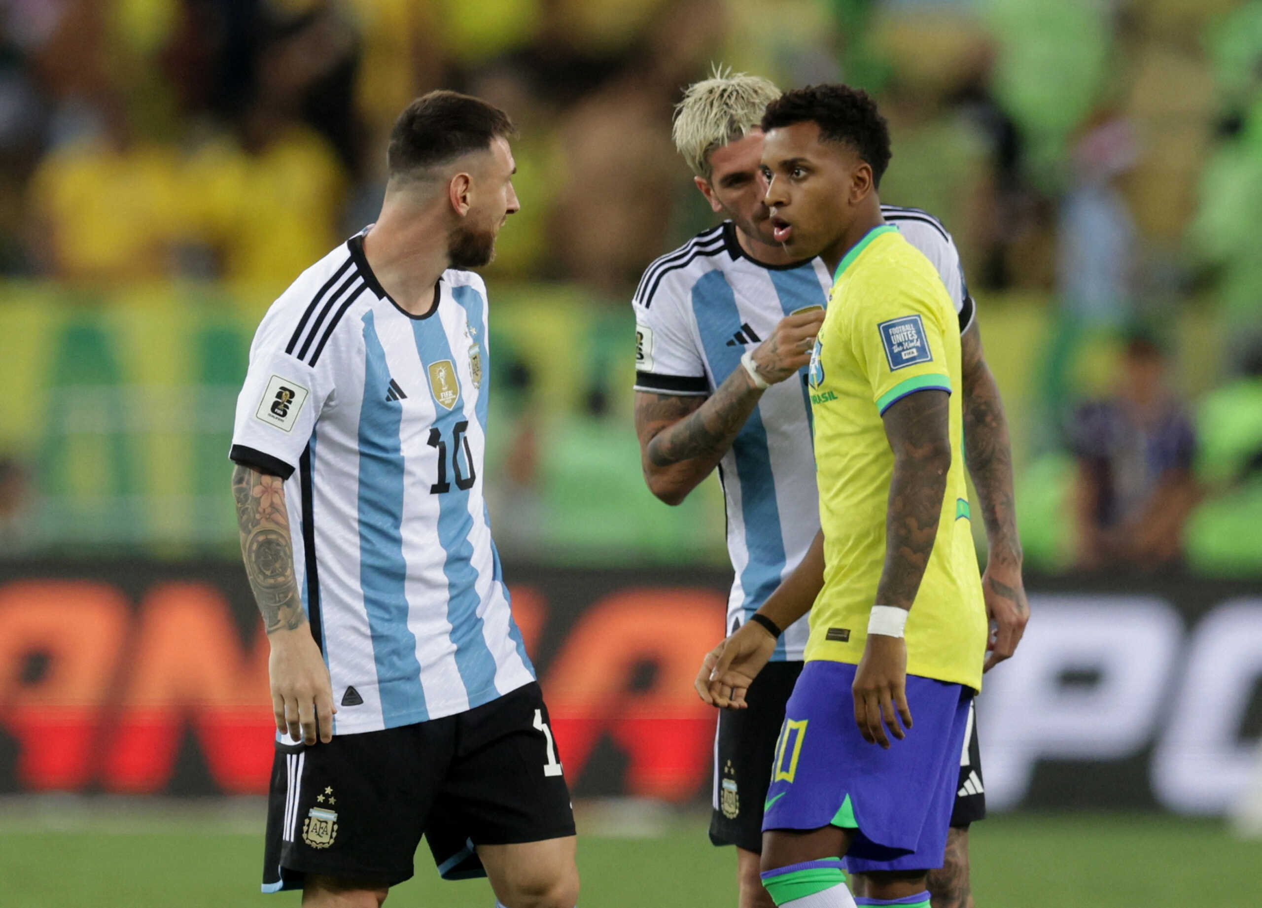 Soccer Football - World Cup - South American Qualifiers - Brazil v Argentina - Estadio Maracana, Rio de Janeiro, Brazil - November 21, 2023 Argentina's Lionel Messi and Brazil's Rodrygo clash before the delayed start of the match REUTERS