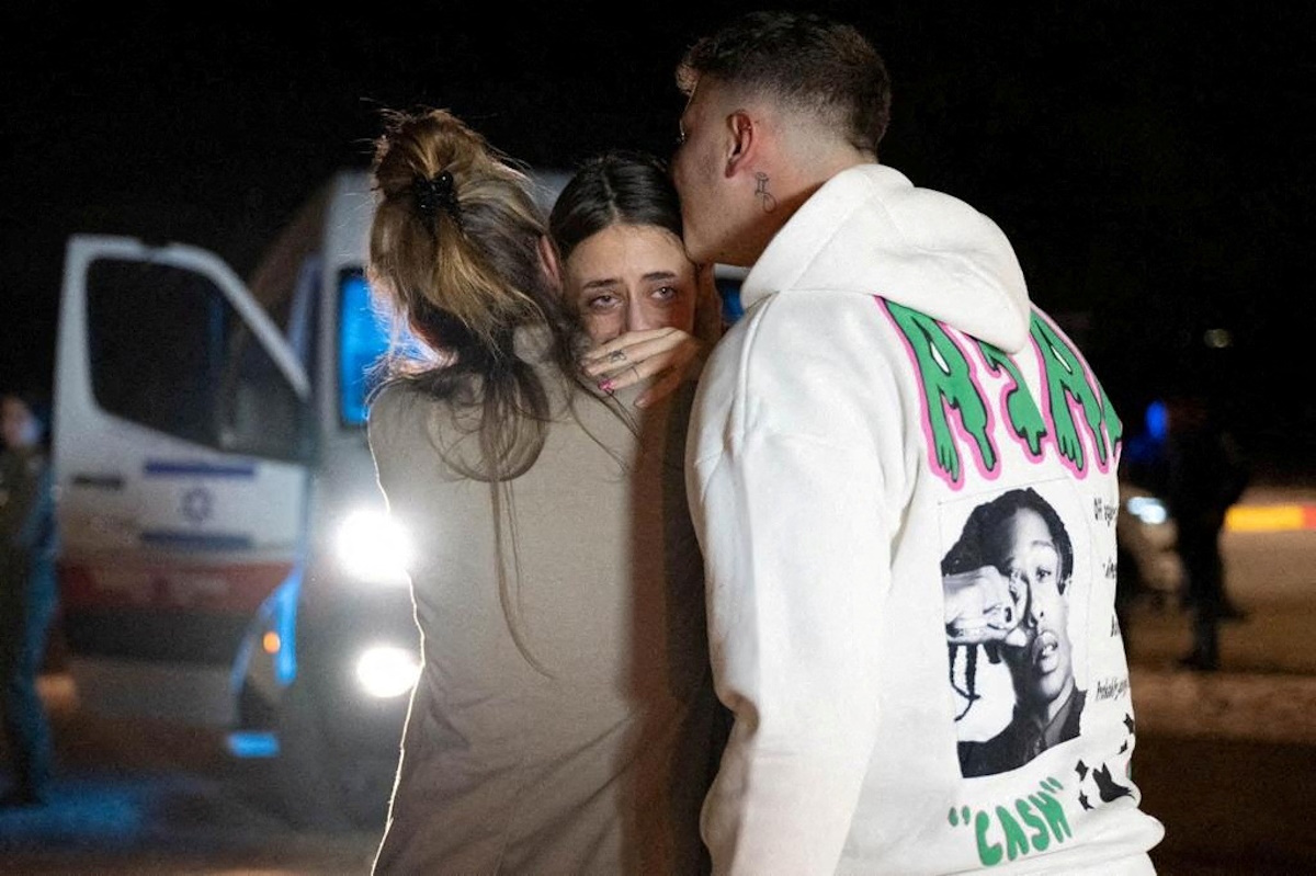 Mia Schem, 21, reunites with her mother and brother following her release after being held hostage by the Palestinian militant group Hamas in the Gaza Strip, in Hatzerim military base in Israel, November 30, 2023. Prime Minister's Office