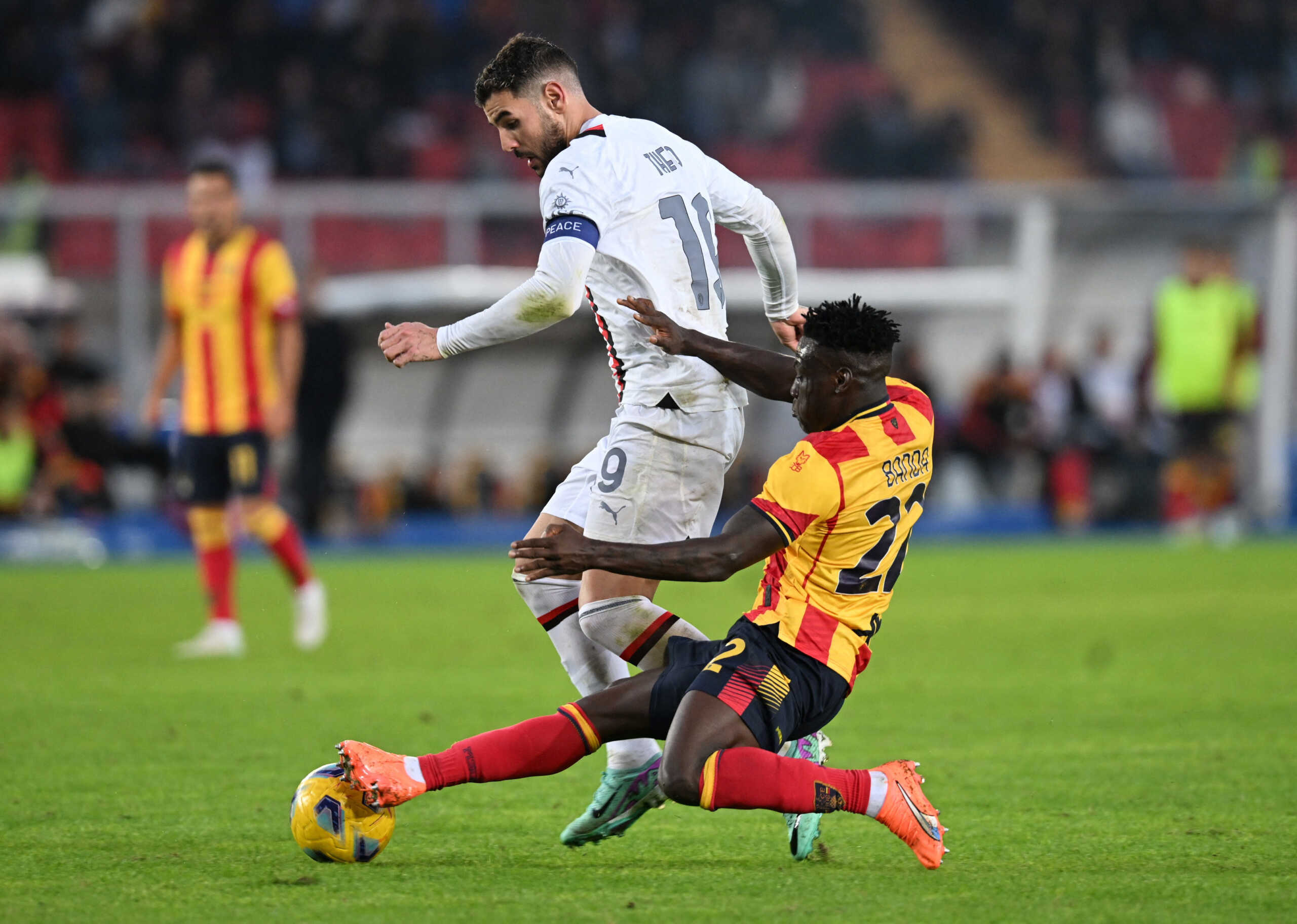 Soccer Football - Serie A - Lecce v AC Milan - Stadio Via del mare, Lecce, Italy - November 11, 2023 AC Milan's Theo Hernandez in action with Lecce's Lameck Banda REUTERS