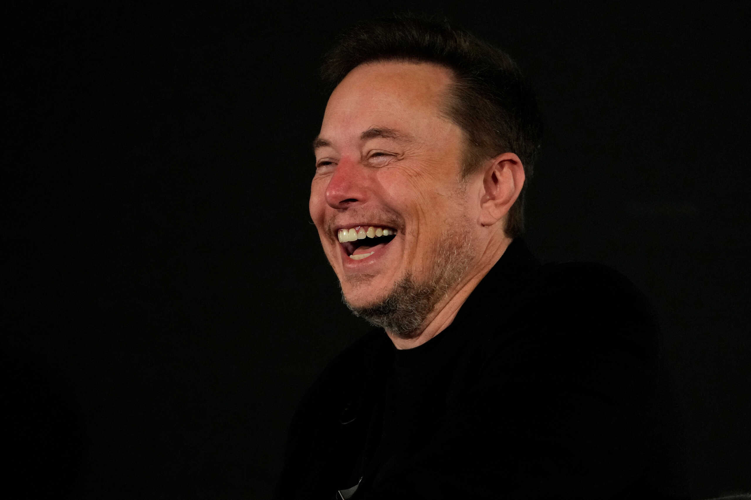 Tesla and SpaceX's CEO Elon Musk laughs during an in-conversation event with British Prime Minister Rishi Sunak in London, Britain, Thursday, Nov. 2, 2023. Kirsty Wigglesworth