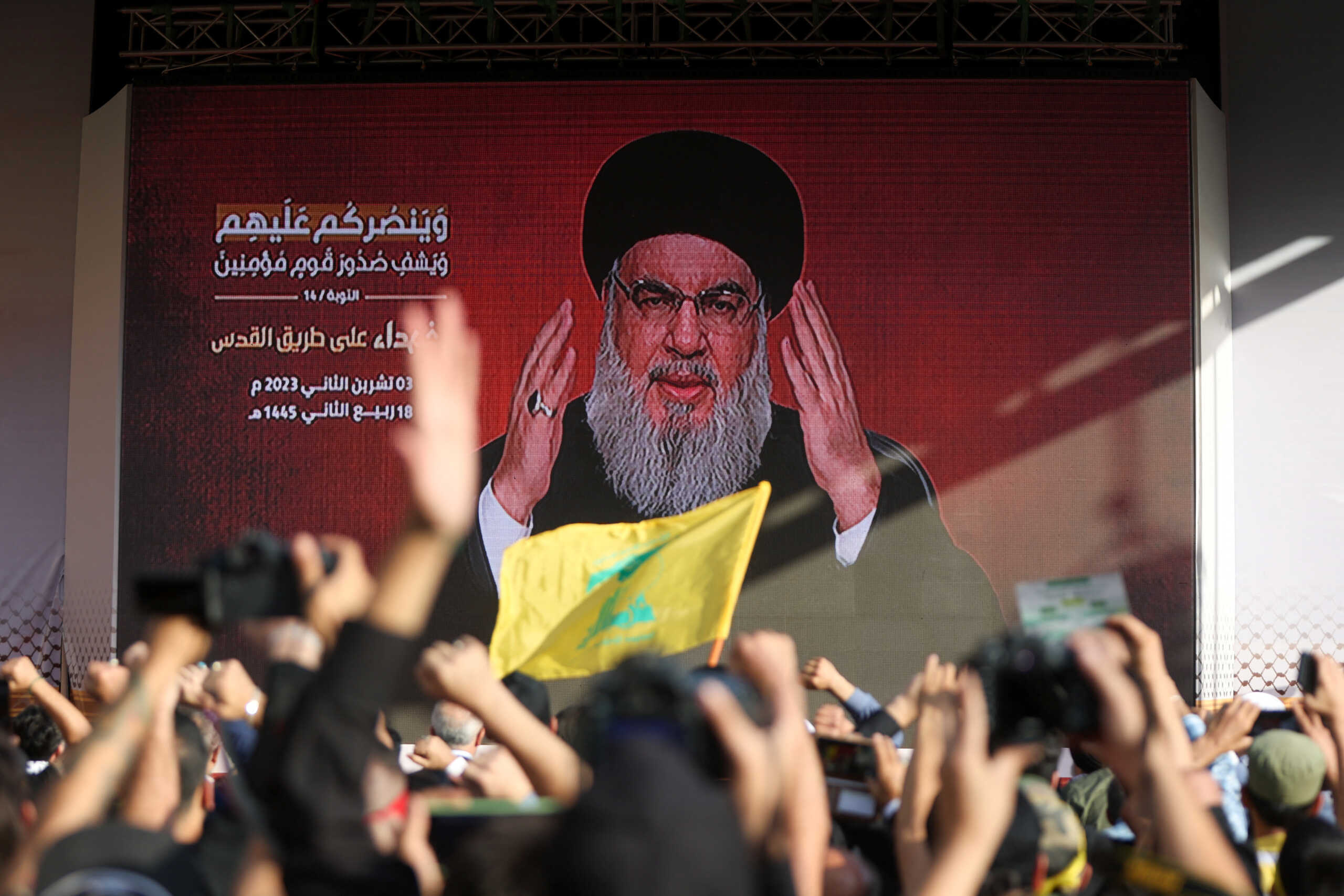 Lebanon's Hezbollah leader Sayyed Hassan Nasrallah appears on a screen as he addresses his supporters during a ceremony to honour fighters killed in the recent escalation with Israel, in Beirut's southern suburbs, Lebanon November 3, 2023. REUTERS