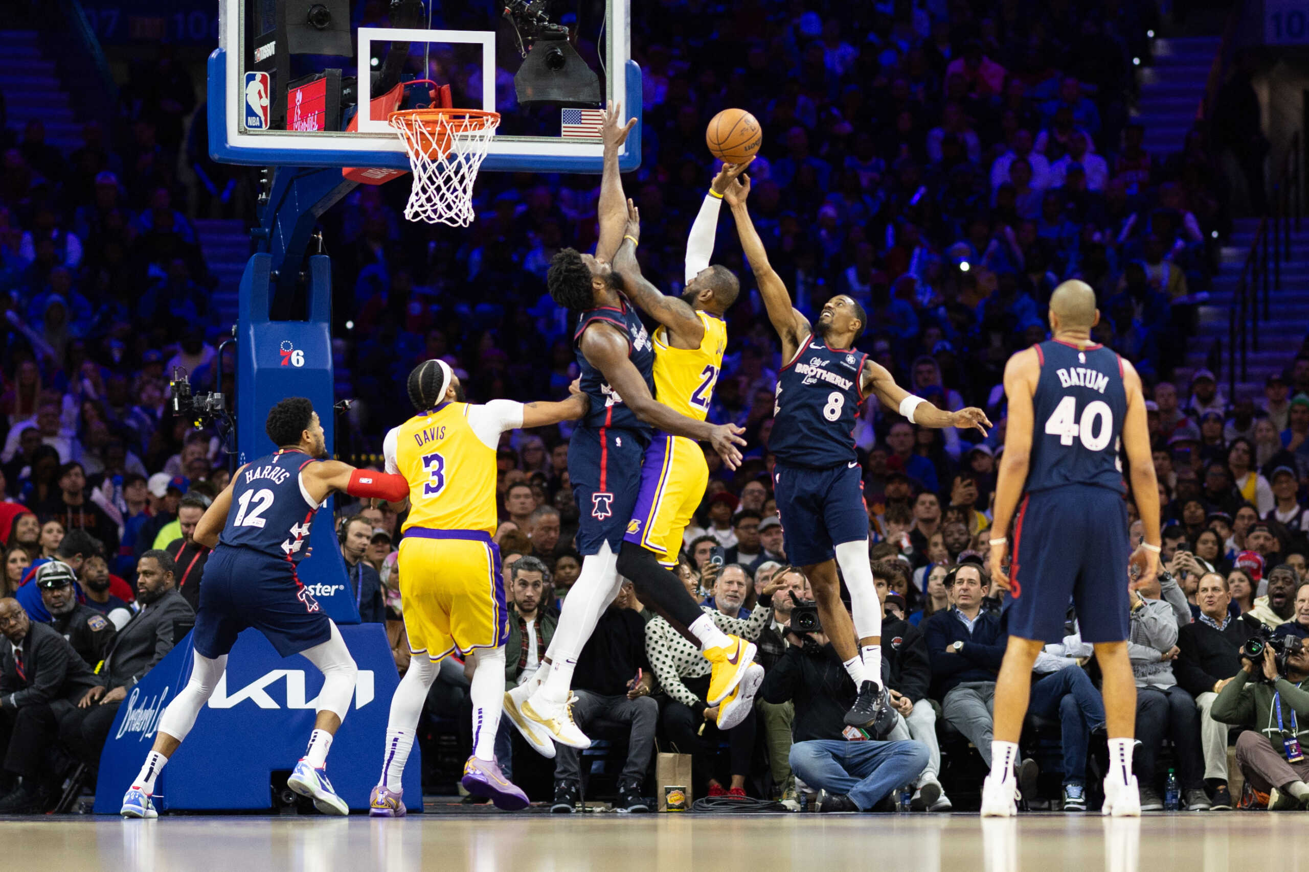 Nov 27, 2023; Philadelphia, Pennsylvania, USA; Philadelphia 76ers center Joel Embiid (21) and guard De'Anthony Melton (8) defend the drive attempt of Los Angeles Lakers forward LeBron James (23) during the third quarter at Wells Fargo Center. Mandatory Credit: Bill Streicher-USA TODAY Sports