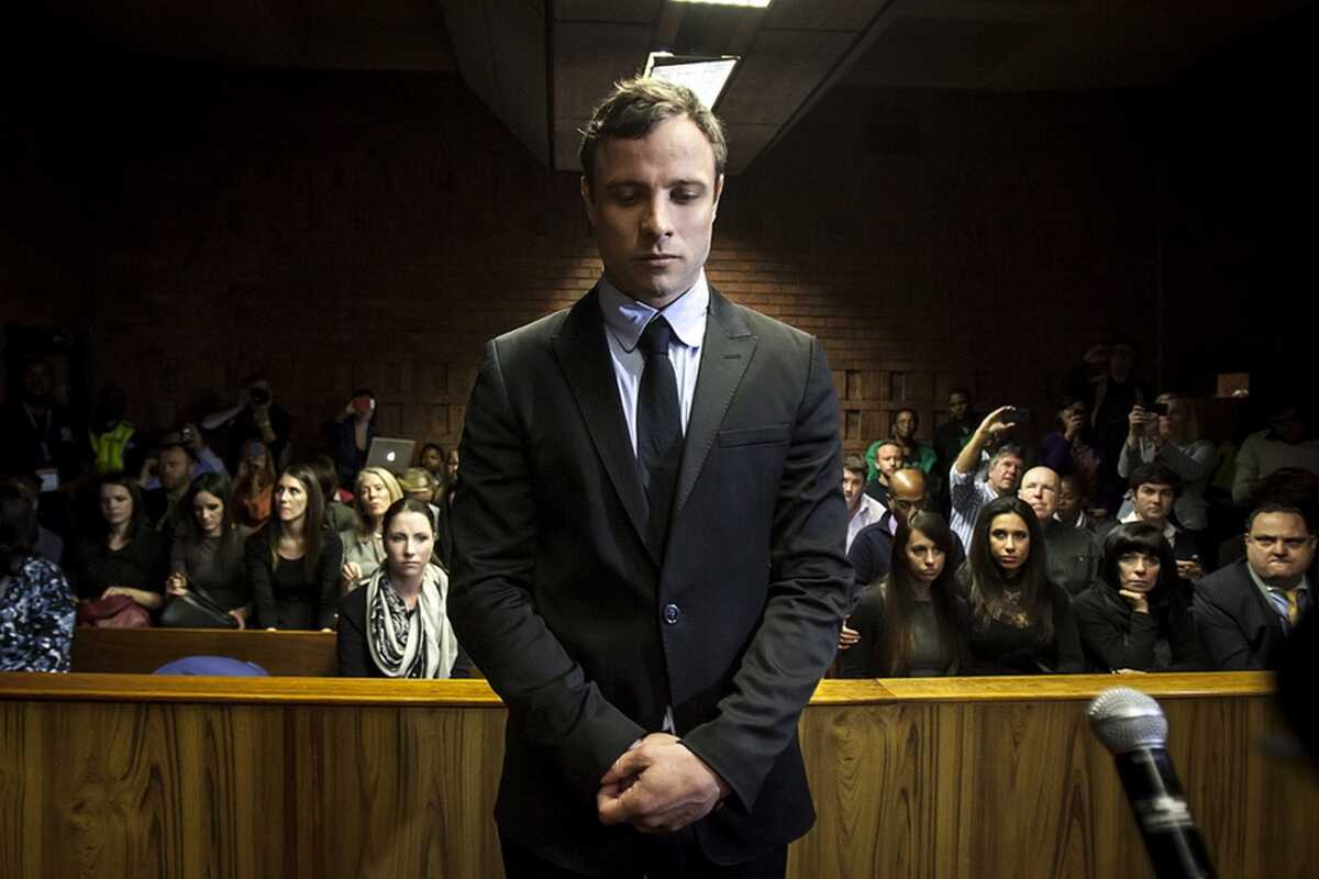 epa10549899 (FILE) Defendant Oscar Pistorius (C) appears in the Pretoria Magistrates court in Pretoria, South Africa, 19 August 2013 (reissued 30 March 2023). South Africa's Correctional Services holds a parole hearing for Oscar Pistorius on 31 March 2023. Former paralympic athlete Pistorius is serving a 13 years and five months imprisonment sentence after an appeal court ìn 2017 found him guilty of the murder of his girlfriend Reeva Steenkamp. Pistorius is eligible for parole after having served half of his sentence.  EPA