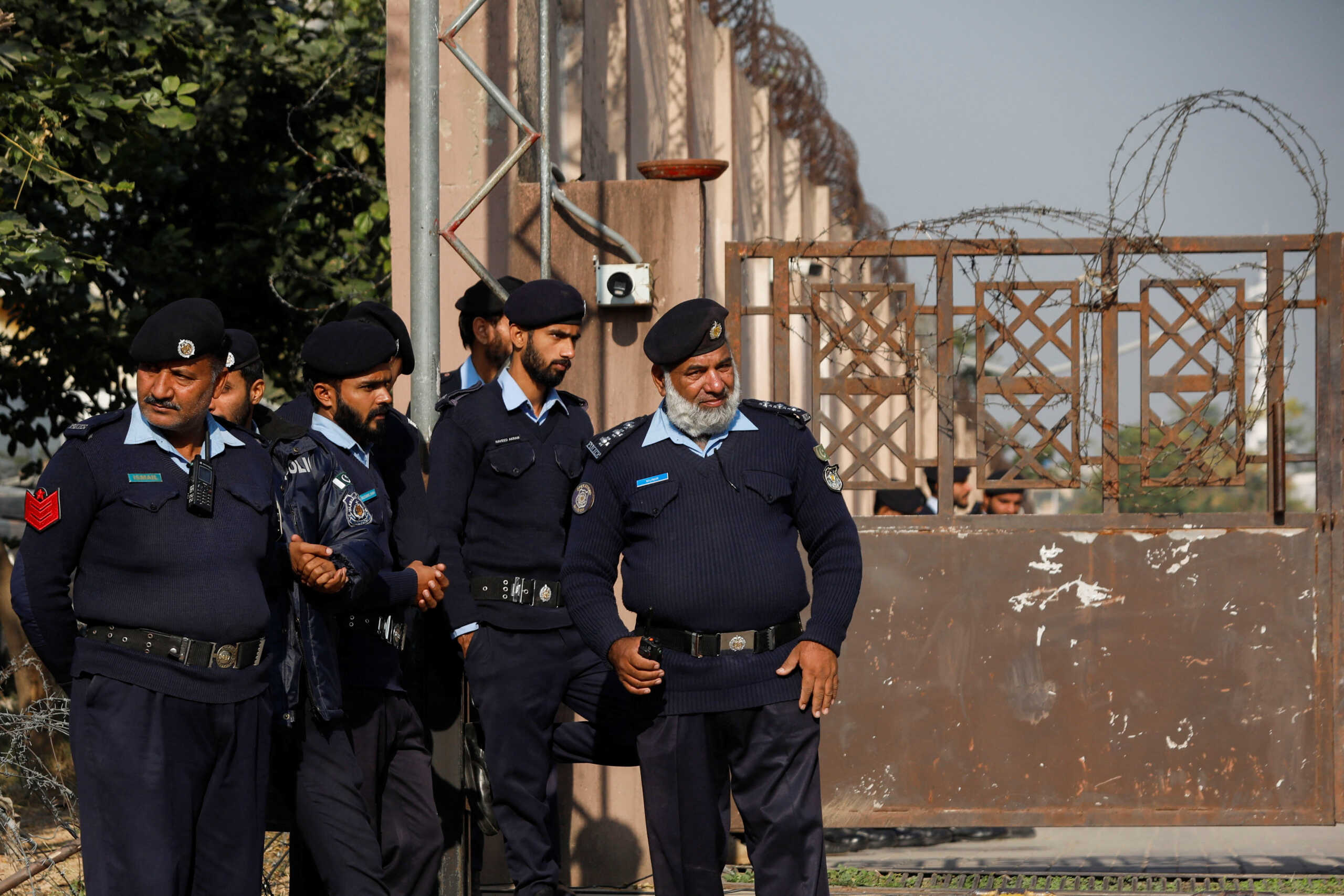 Police officers stand at the entrance of the district Judicial Complex in Islamabad, Pakistan November 28, 2023. REUTERS