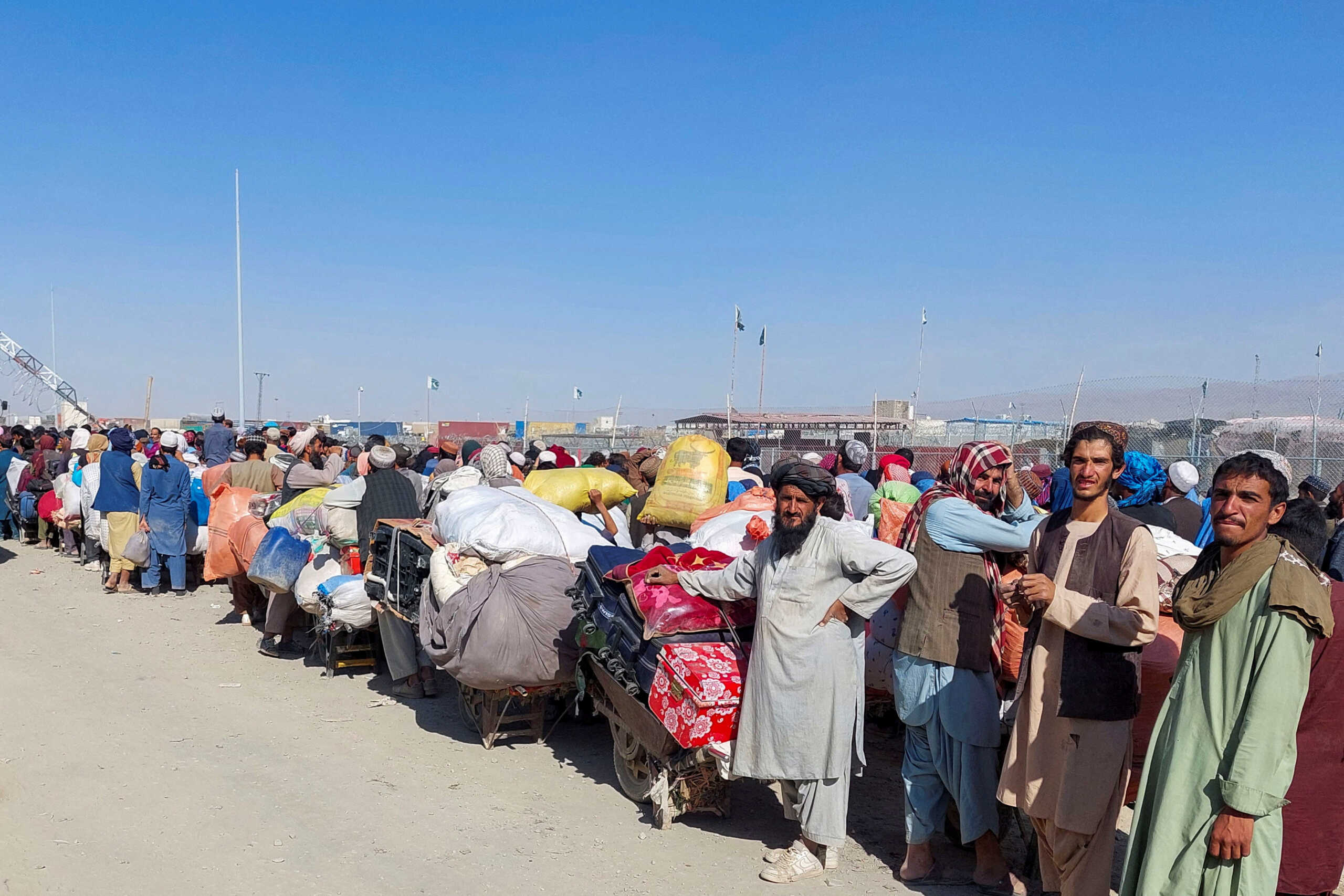 Afghan citizens wait with their belongings to cross into Afghanistan, after Pakistan gives the last warning to undocumented immigrants to leave, at the Friendship Gate of Chaman Border Crossing along the Pakistan-Afghanistan Border in Balochistan Province, in Chaman, Pakistan October 31, 2023. REUTERS