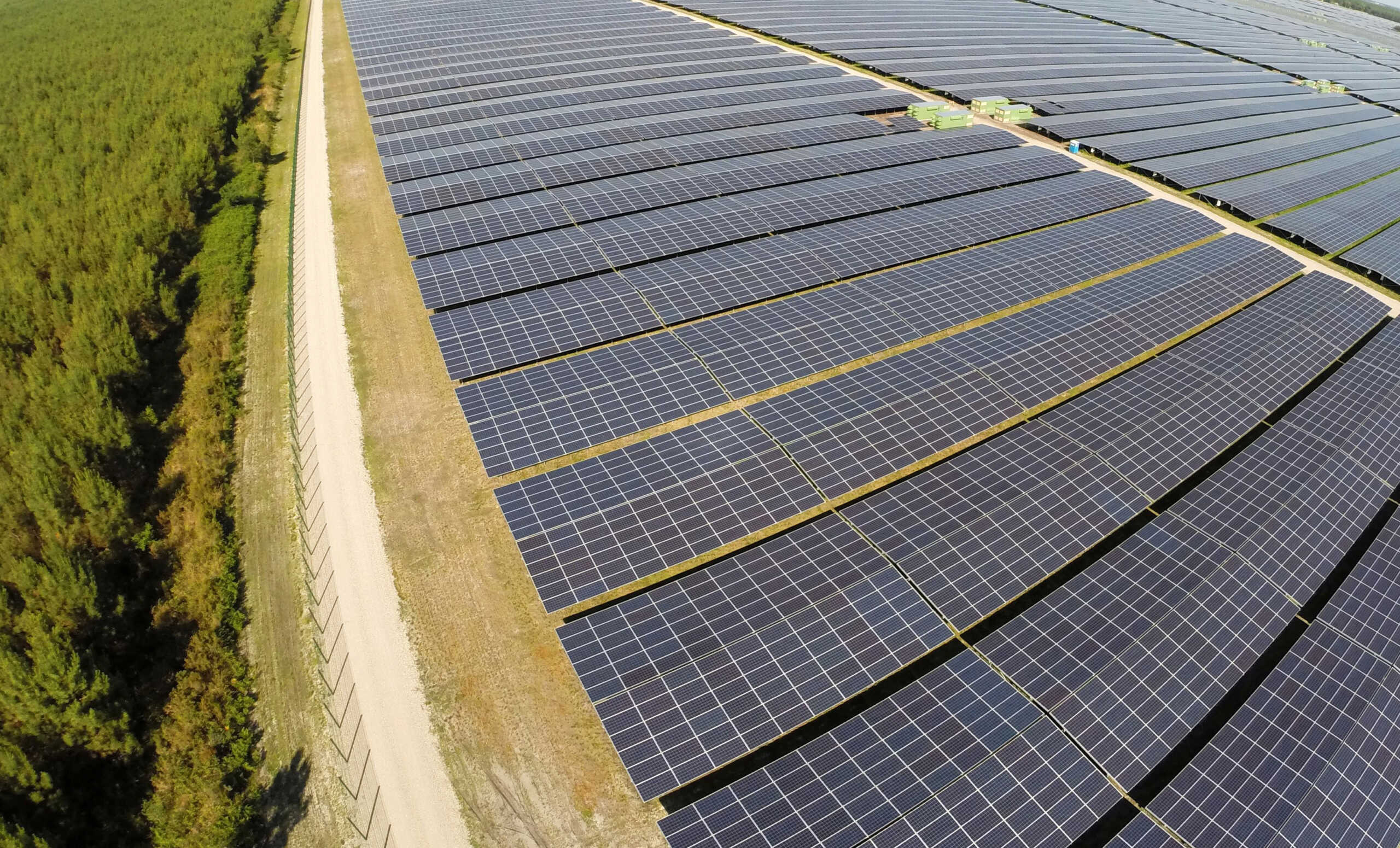 FILE PHOTO: A general view shows solar panels used to produce renewable energy at the photovoltaic park in Cestas, southwestern France, June 19, 2015. The solar farm of Cestas, the biggest in Europe, consists of 1 Million solar modules covering an area of 2,5 km2 of land and representing 300 MW of power. REUTERS