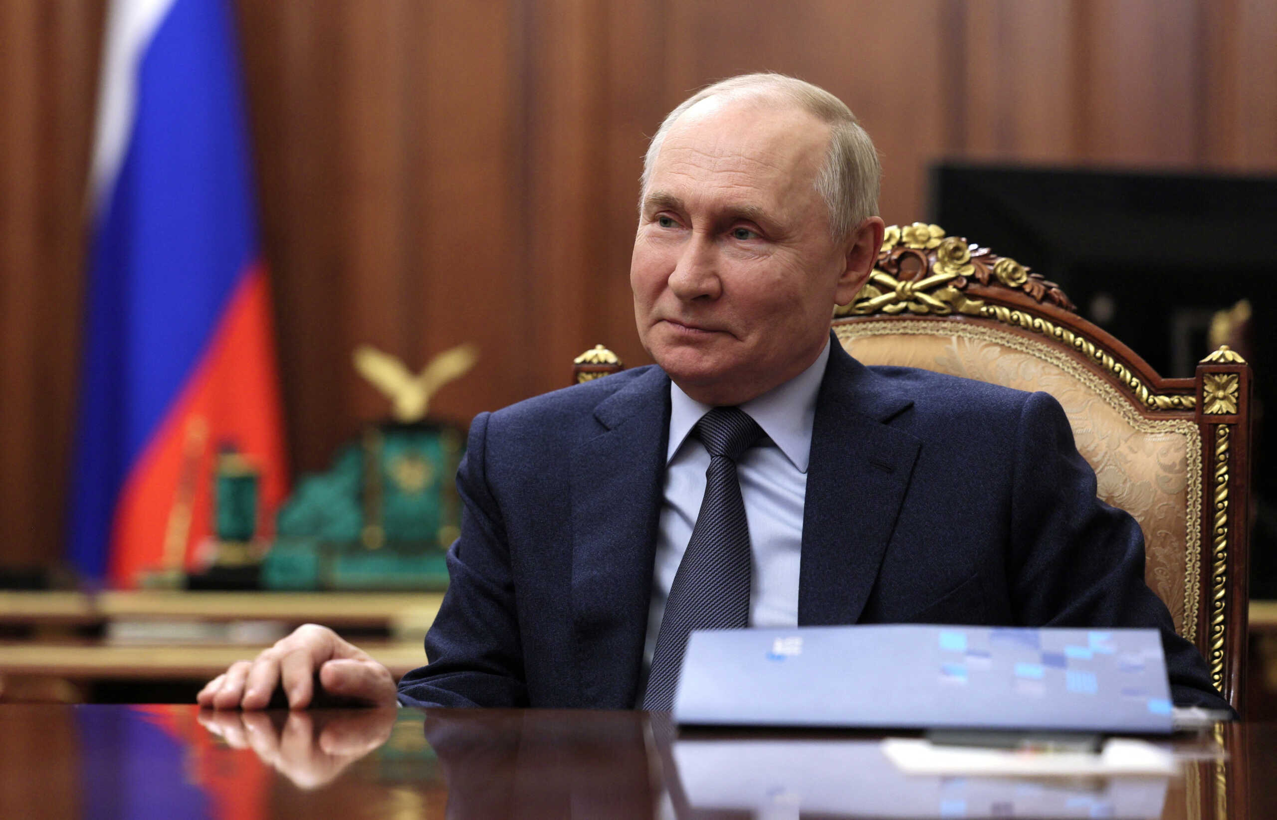 Russian President Vladimir Putin attends a meeting with CEO of VTB bank Andrei Kostin in Moscow, Russia, November 27, 2023. Sputnik