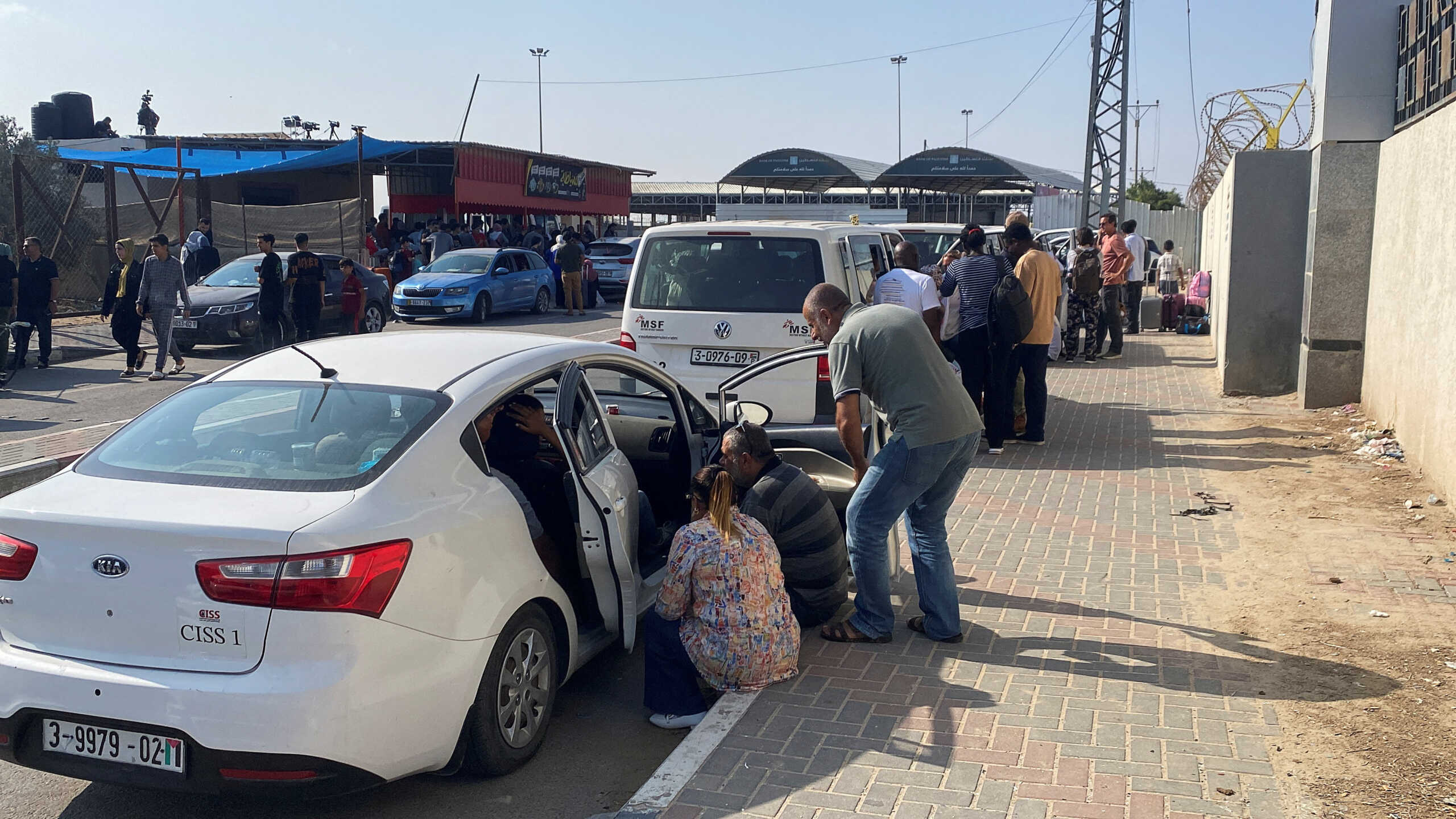 Palestinians with dual citizenship wait outside the Rafah border crossing with Egypt, in the hope of getting permission to leave Gaza, amid the ongoing conflict between Israel and Palestinian Islamist group Hamas, in Rafah in the southern Gaza Strip, November 1, 2023. REUTERS