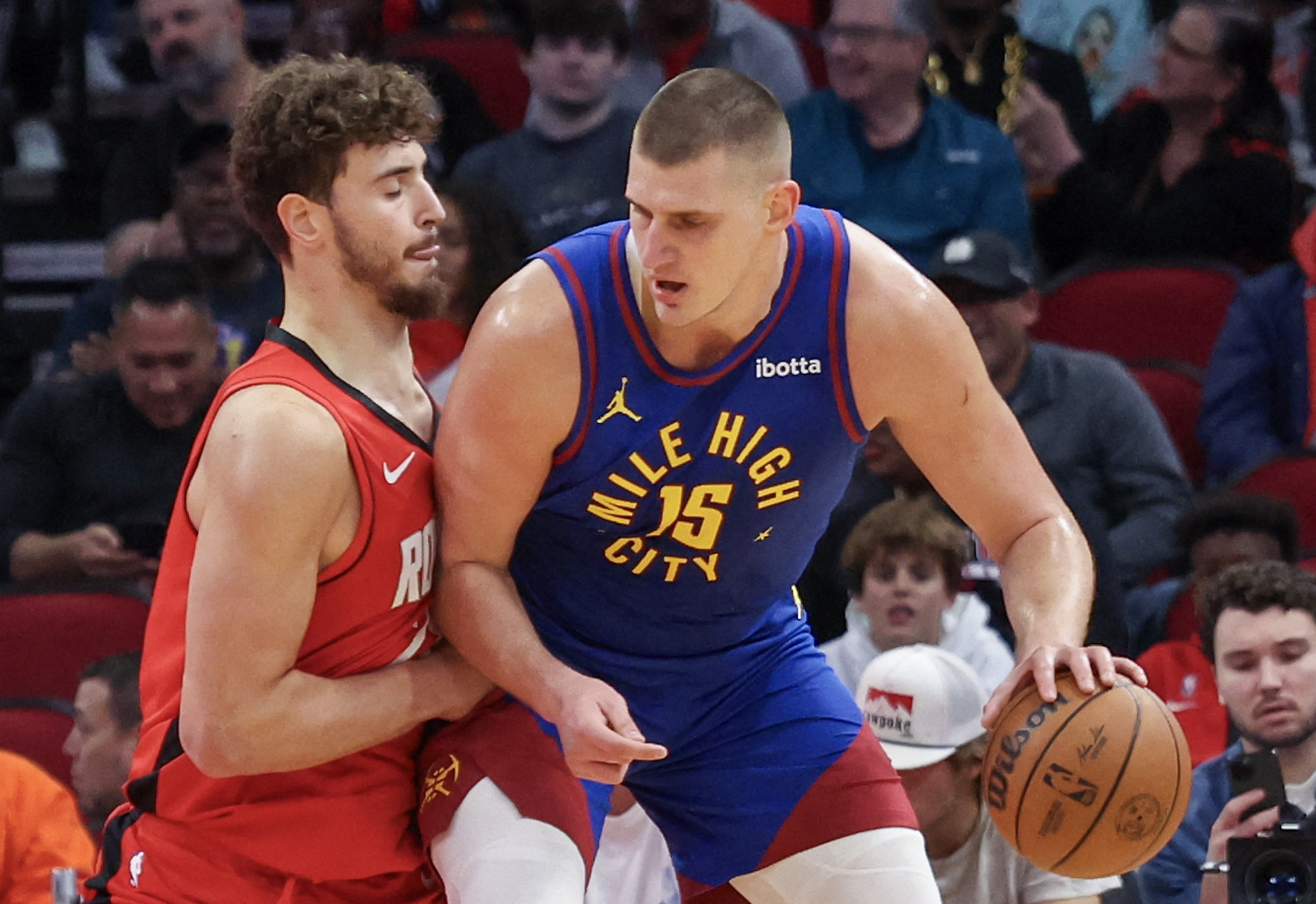 Nov 12, 2023; Houston, Texas, USA; Denver Nuggets center Nikola Jokic (15) dribbles against Houston Rockets center Alperen Sengun (28) in the first quarter  at Toyota Center. Mandatory Credit: Thomas Shea-USA TODAY Sports