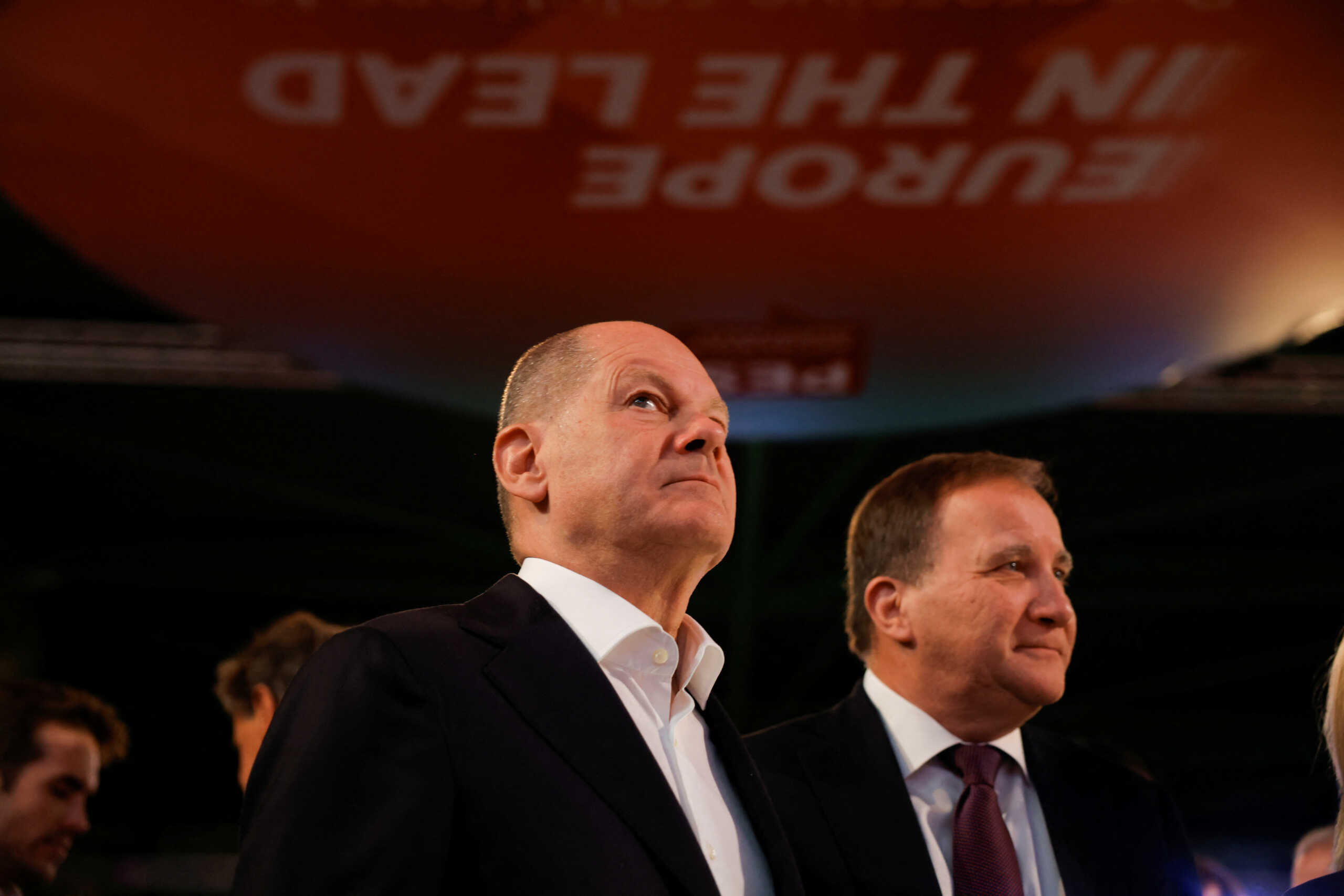 German Chancellor Olaf Scholz looks on next to the President of the Party of European Socialists (PES) Stefan Lofven during the meeting of the Party of European Socialists in Malaga, Spain, November 11, 2023. REUTERS