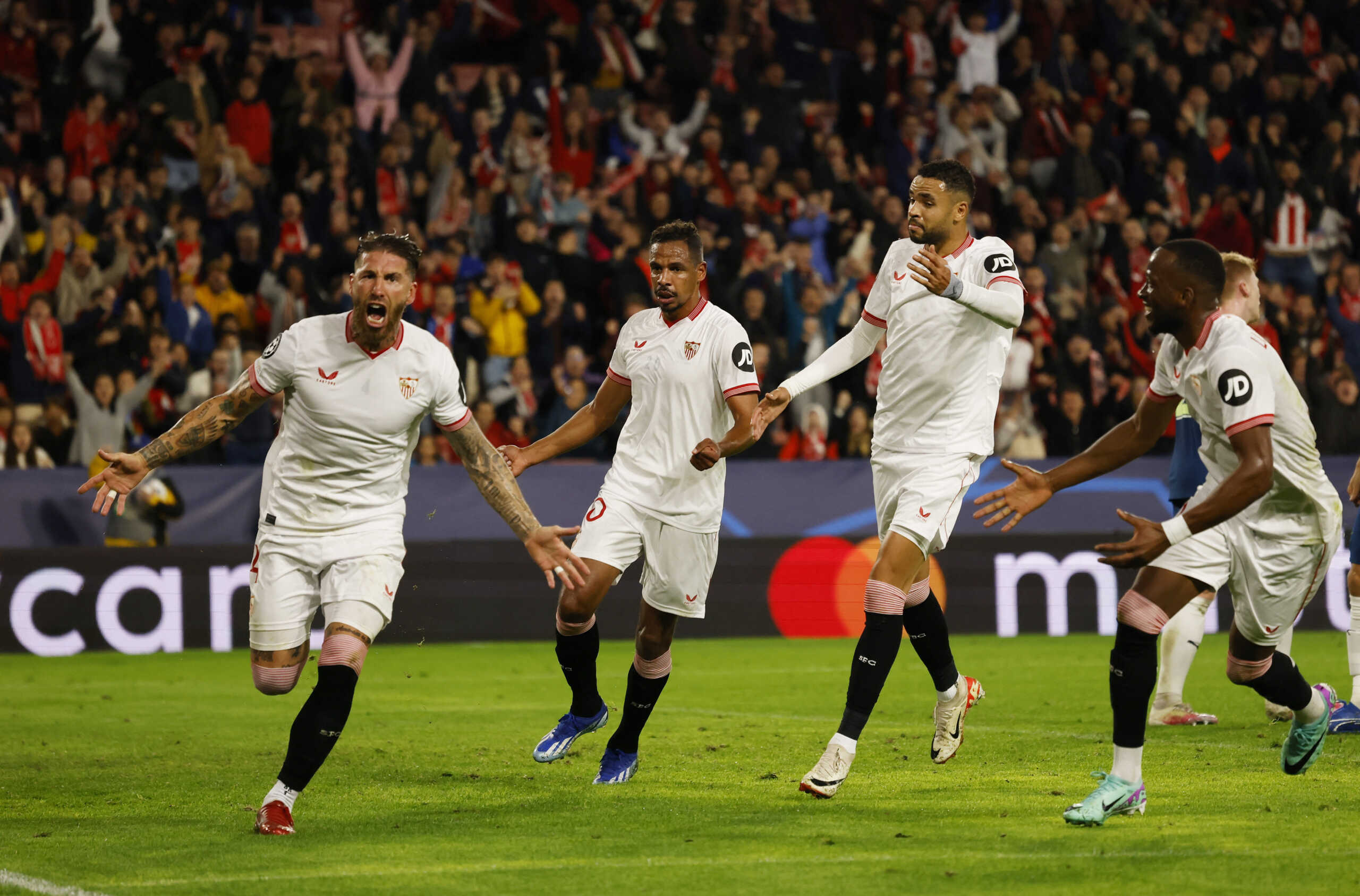 Soccer Football - Champions League - Group B - Sevilla v PSV Eindhoven - Estadio Ramon Sanchez Pizjuan, Seville, Spain - November 29, 2023 Sevilla's Sergio Ramos celebrates scoring their first goal with teammates REUTERS