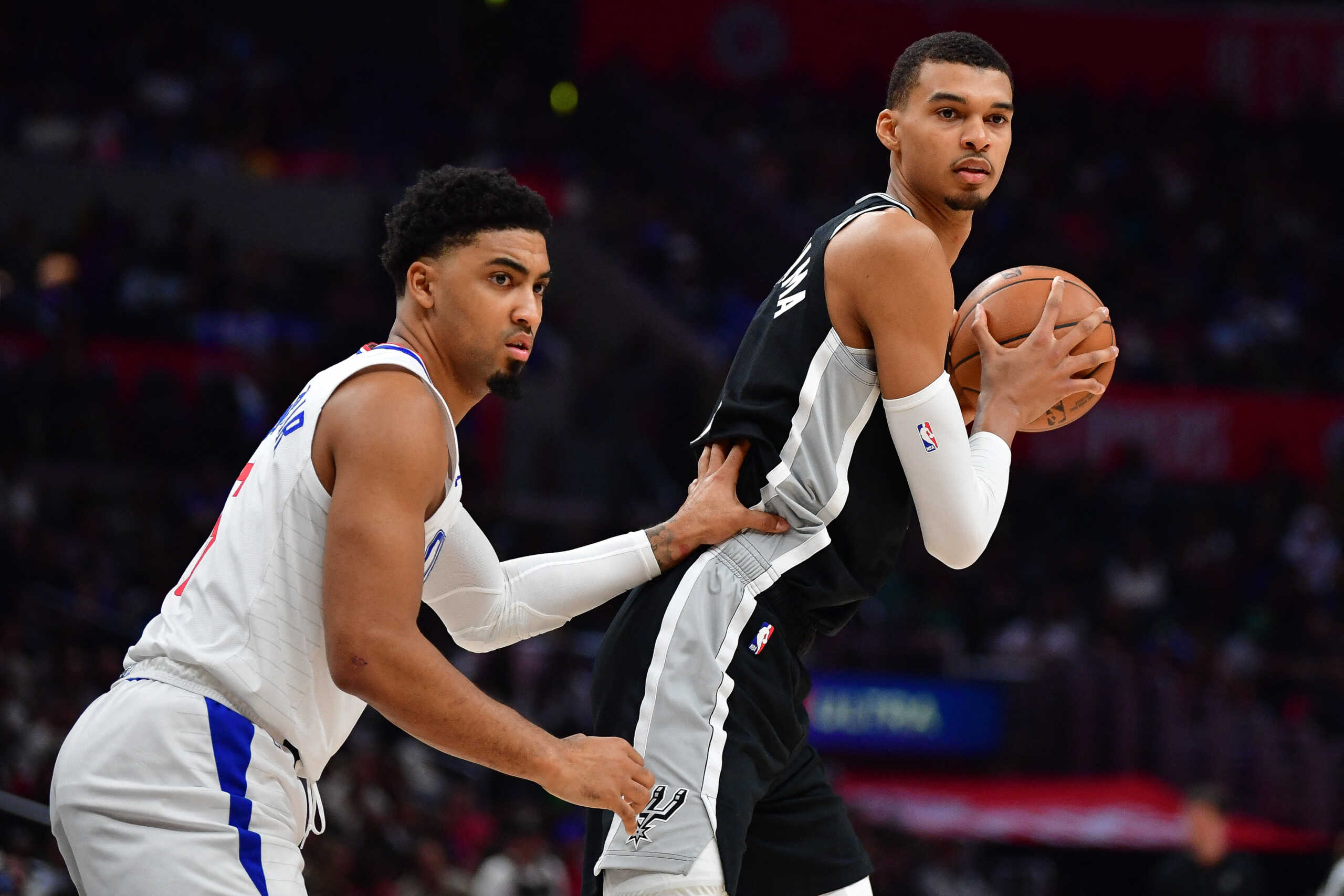 Oct 29, 2023; Los Angeles, California, USA; San Antonio Spurs center Victor Wembanyama (1) controls the ball against Los Angeles Clippers forward Kenyon Martin Jr. (6) during the second half at Crypto.com Arena. Mandatory Credit: Gary A. Vasquez-USA TODAY Sports