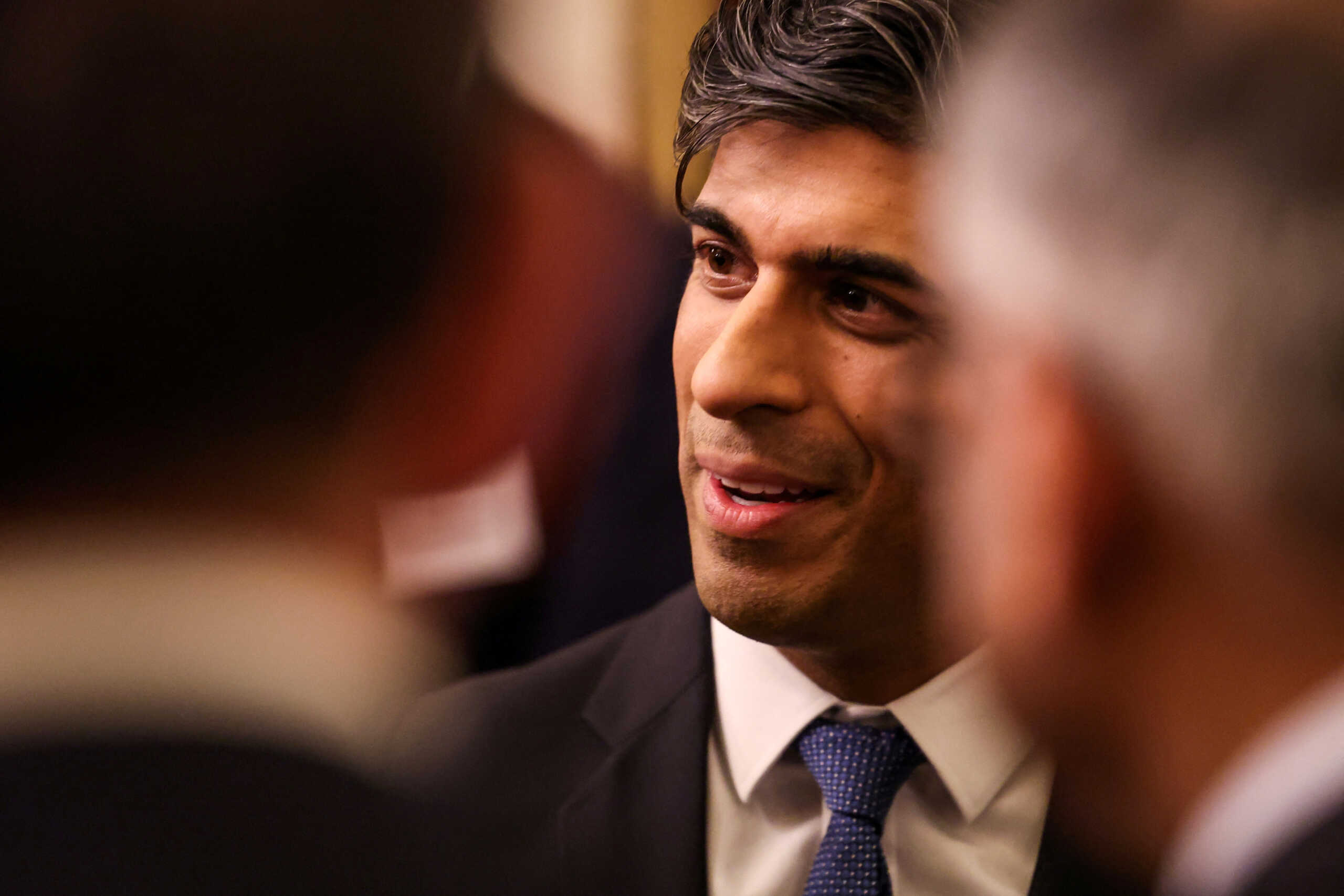 Britain's Prime Minister Rishi Sunak reacts as he attends a reception at Buckingham Palace, in central London, on November 27, 2023 hosted by Britain's King Charles to mark the conclusion of the Global Investment Summit. DANIEL LEAL
