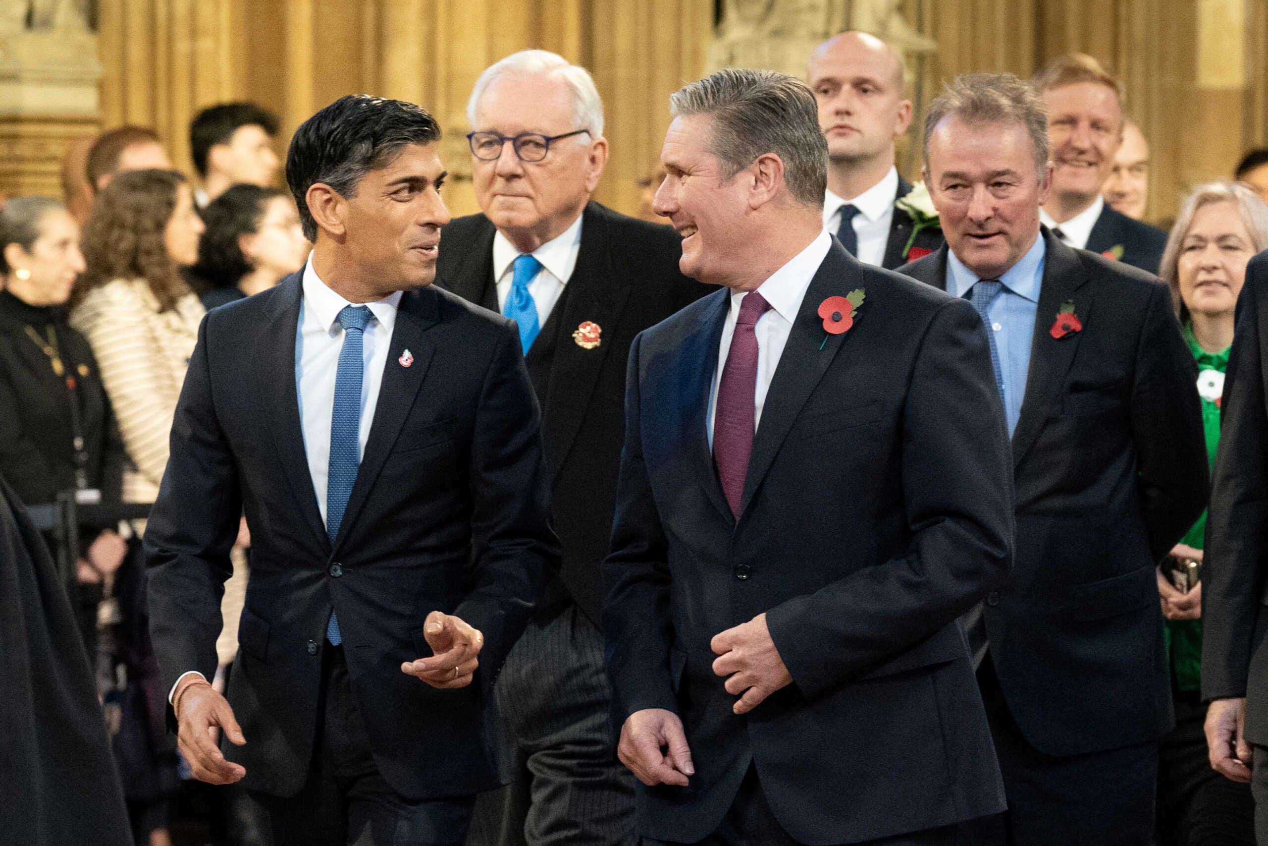 Britain's Prime Minister Rishi Sunak walks with Labour Party leader Sir Keir Starmer through the Central Lobby at the Palace of Westminster ahead of the State Opening of Parliament in the House of Lords, in London, Britain, November 7, 2023. Stefan Rousseau