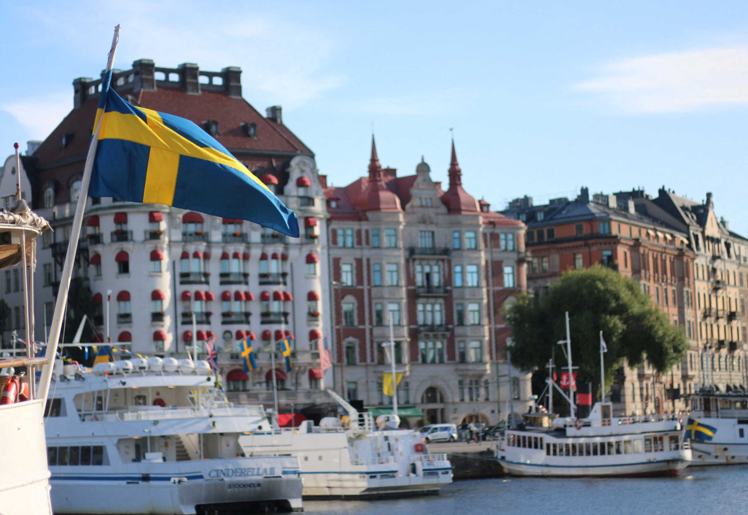 FILE PHOTO: A Swedish flag flutters in front of residential houses in Stockholm, Sweden, September 14, 2023. REUTERS