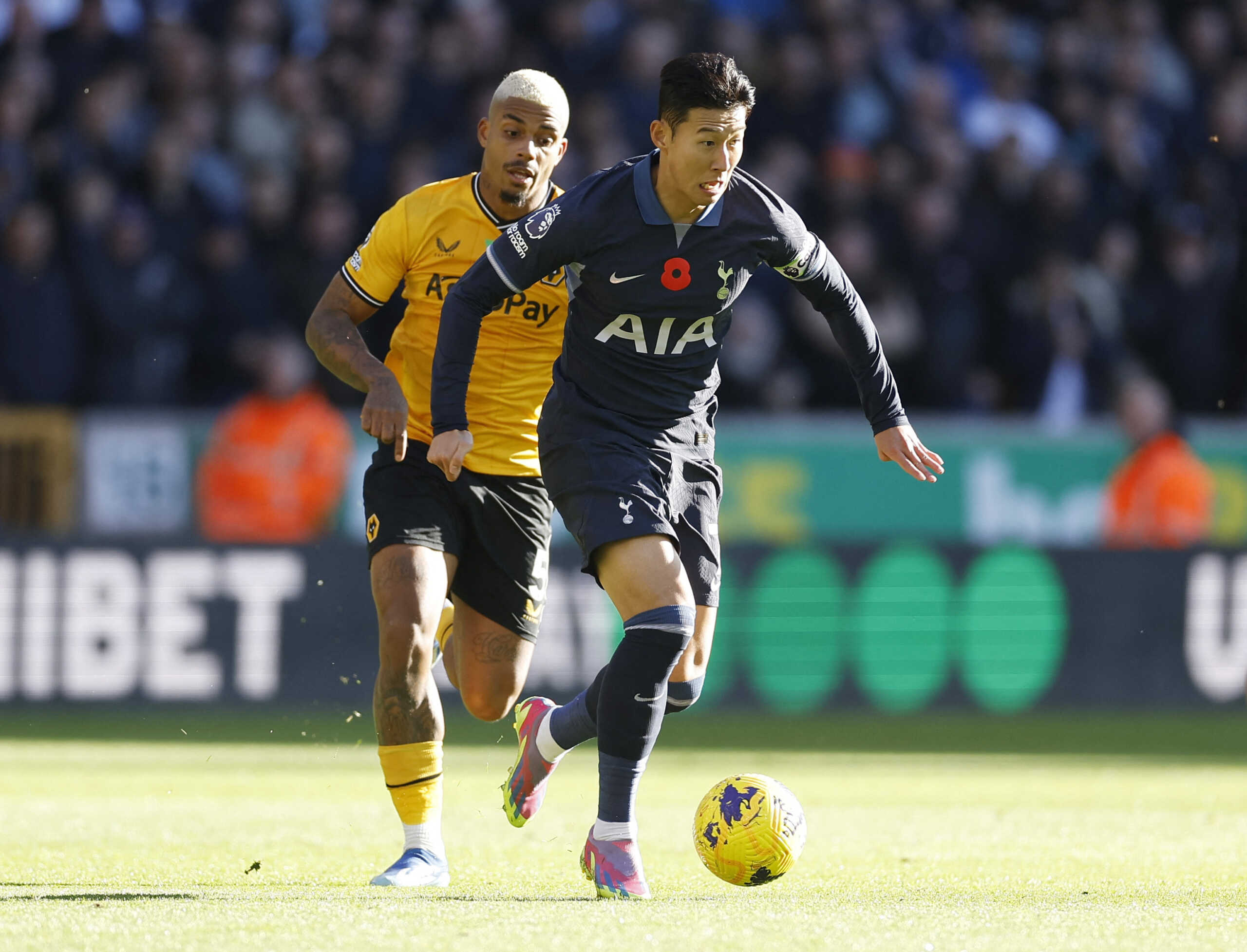 Soccer Football - Premier League - Wolverhampton Wanderers v Tottenham Hotspur - Molineux Stadium, Wolverhampton, Britain - November 11, 2023  Tottenham Hotspur's Son Heung-min in action with Wolverhampton Wanderers' Mario Lemina Action Images via Reuters
