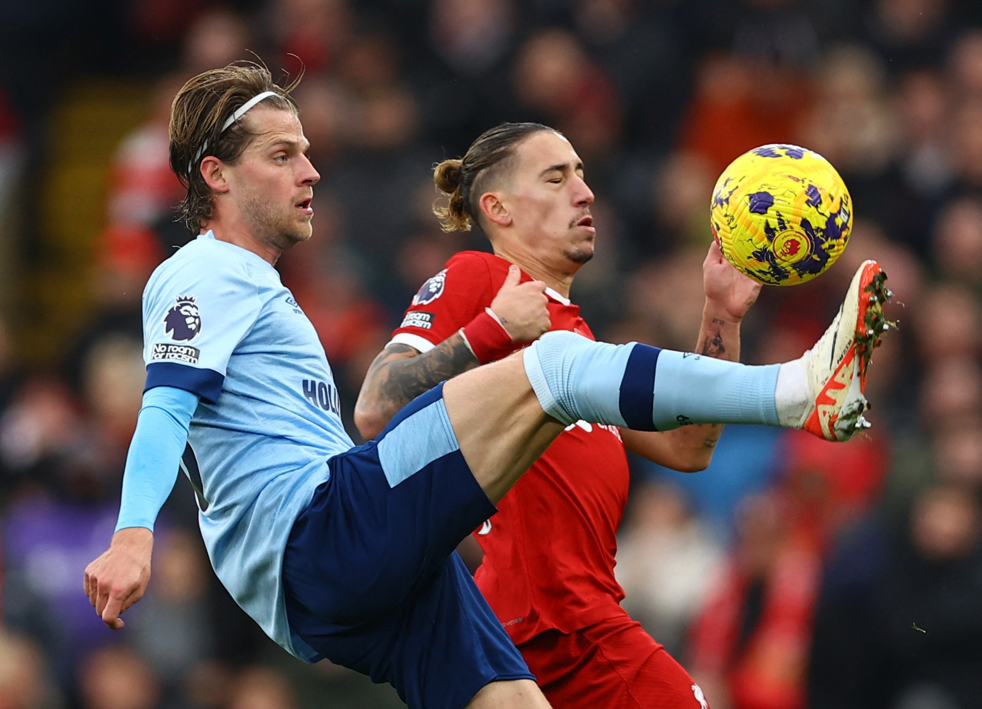 Soccer Football - Premier League - Liverpool v Brentford - Anfield, Liverpool, Britain - November 12, 2023 Liverpool's Kostas Tsimikas in action with Brentford's Mathias Jensen REUTERS