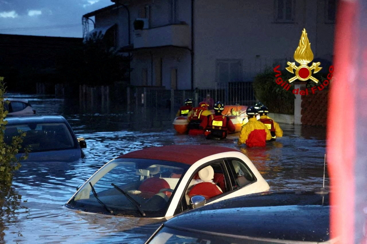 FILE PHOTO: Italian firefighters work in flooded streets in the Tuscany region, Italy, November 3, 2023. Several people died and went missing in the central region of Tuscany as Storm Ciaran battered western Europe. Vigili del Fuoco