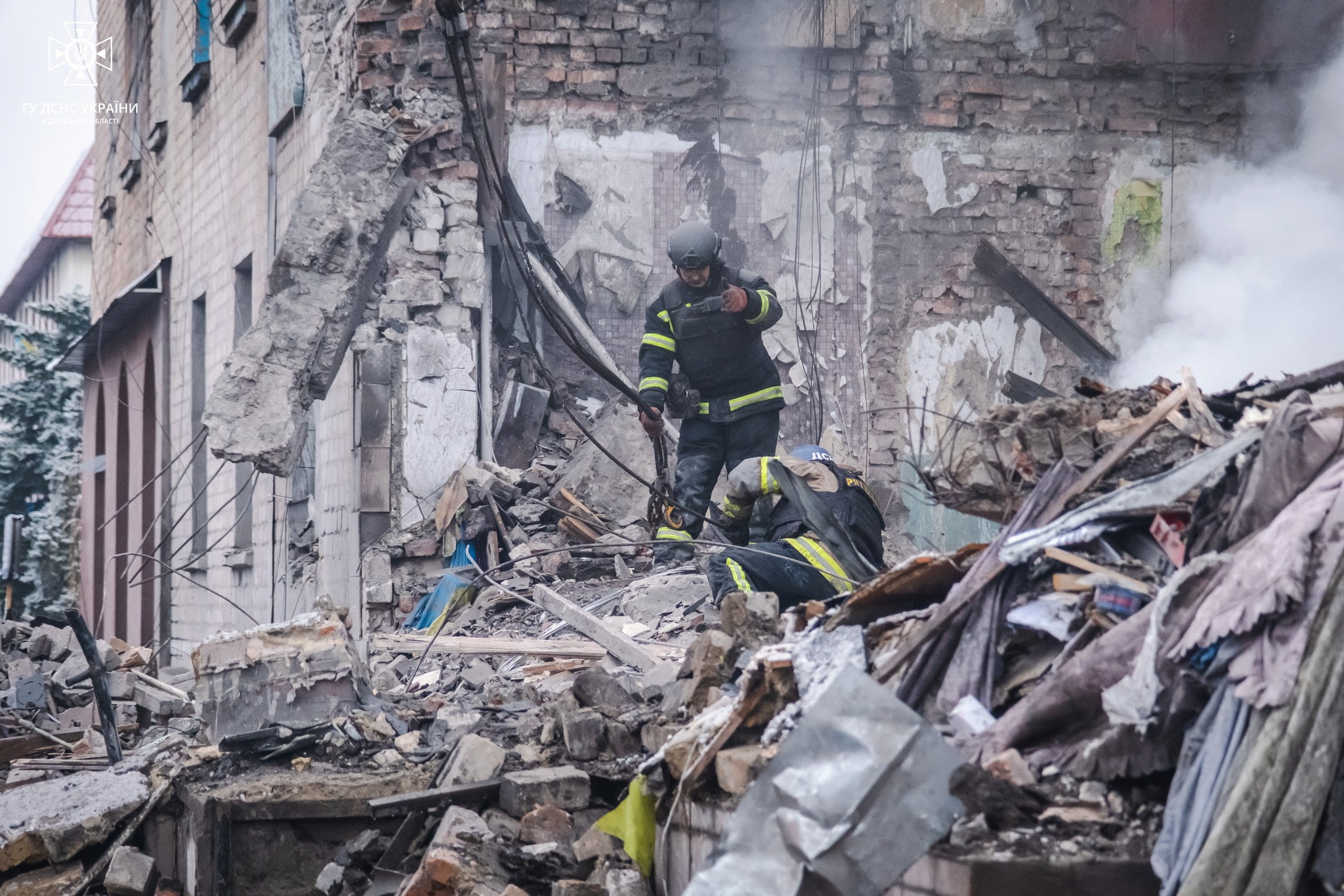 Rescues work at a site of a residential building heavily damaged by a Russian missile strike, amid Russia's attack on Ukraine, in the town of Novohrodivka, Donetsk region, Ukraine November 30, 2023. Press service of the State Emergency Service of Ukraine in Donetsk region