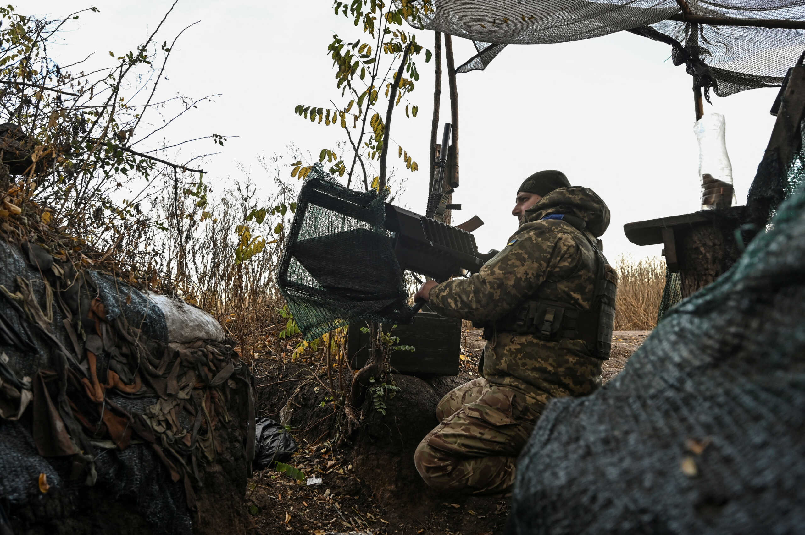A Ukrainian serviceman uses an anti-drone rifle at a position in a frontline, amid Russia's attack on Ukraine, in Zaporizhzhia region, Ukraine November 3, 2023. REUTERS