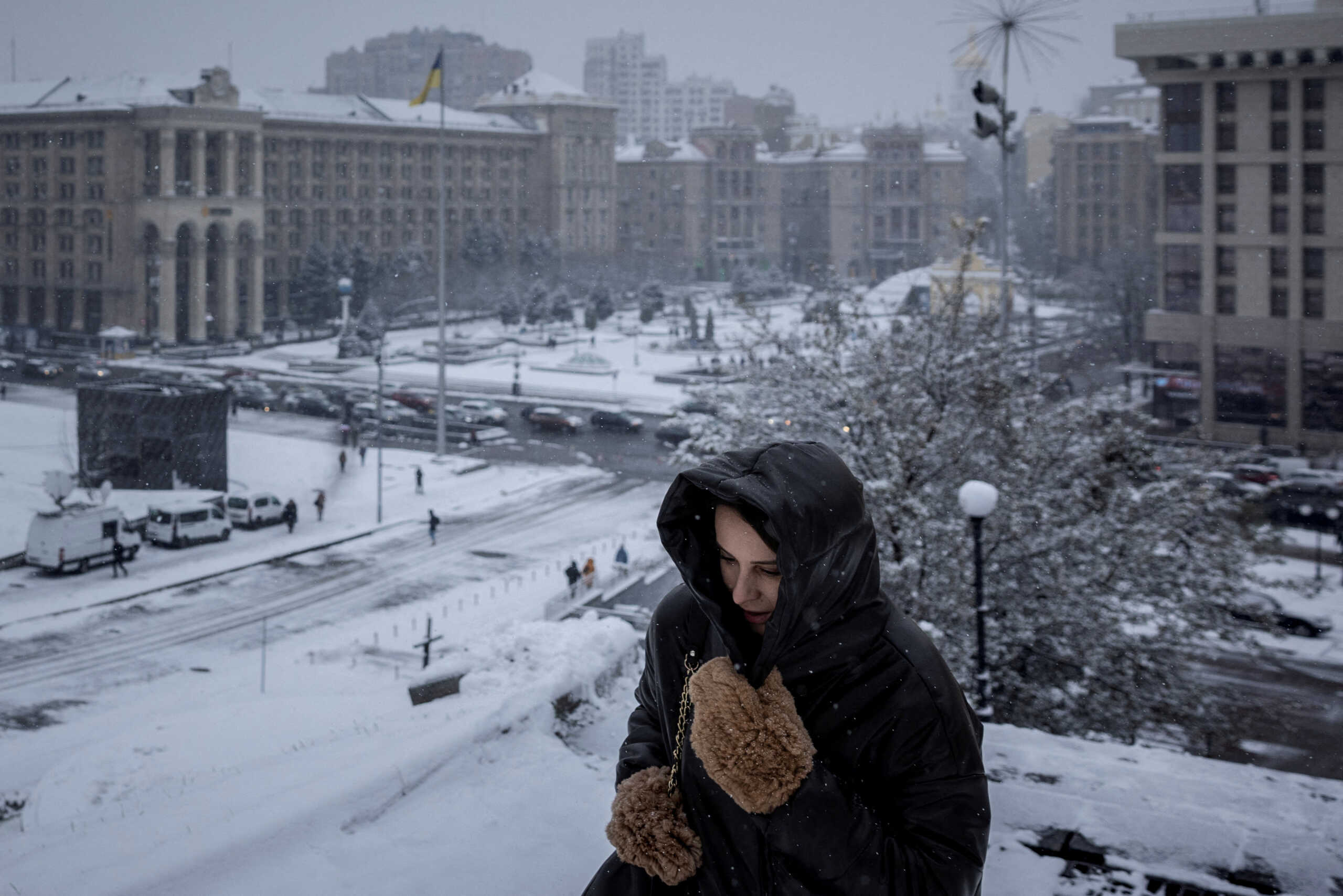 A woman walks near Independence Square (Maidan Nezalezhnosti) on the first snowy day of the year in Kyiv, amid Russia’s attack on Ukraine, November 22, 2023.  REUTERS