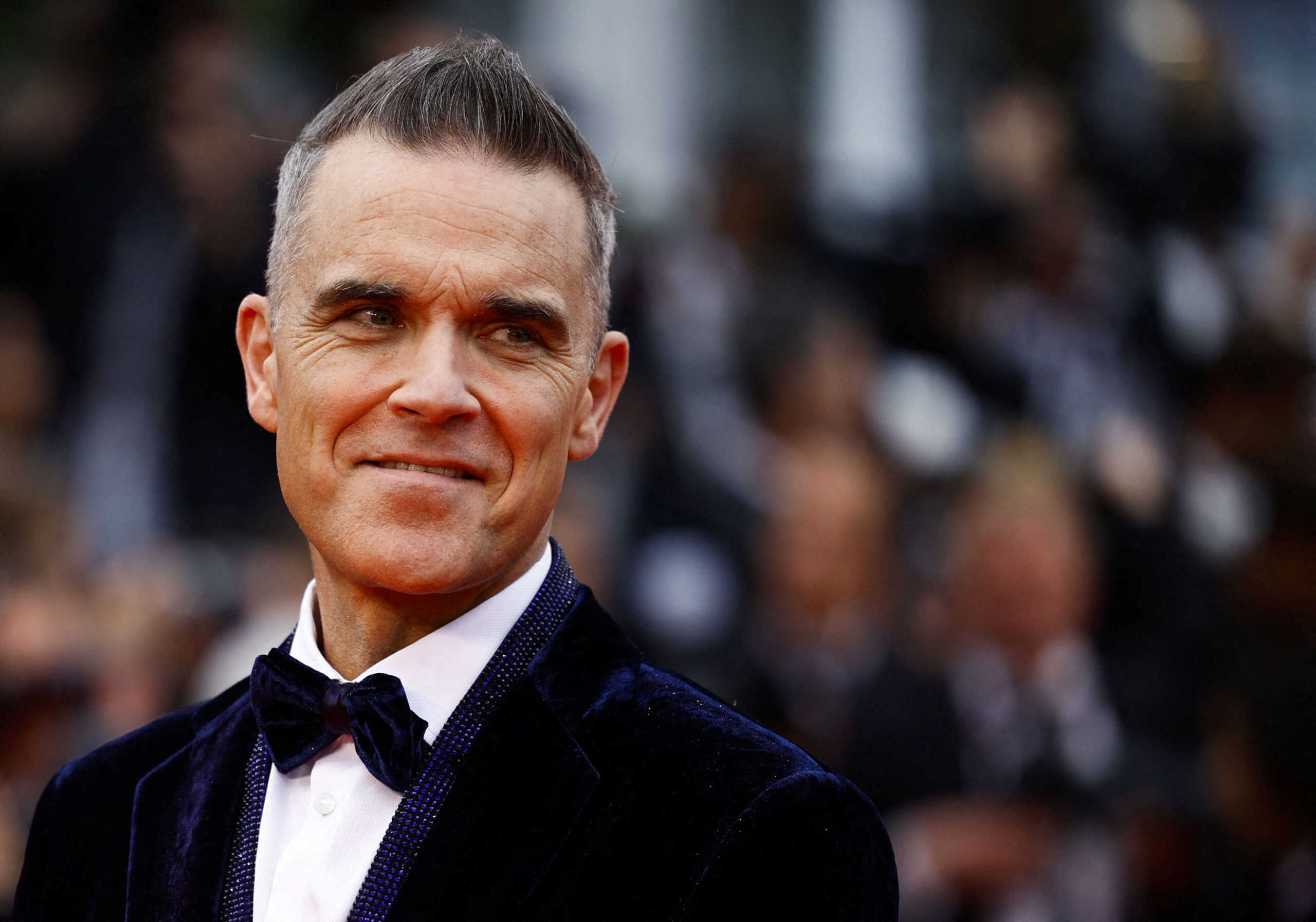 FILE PHOTO: Robbie Williams poses at the Cannes Film Festival in Cannes, France, May 20,  2023. REUTERS