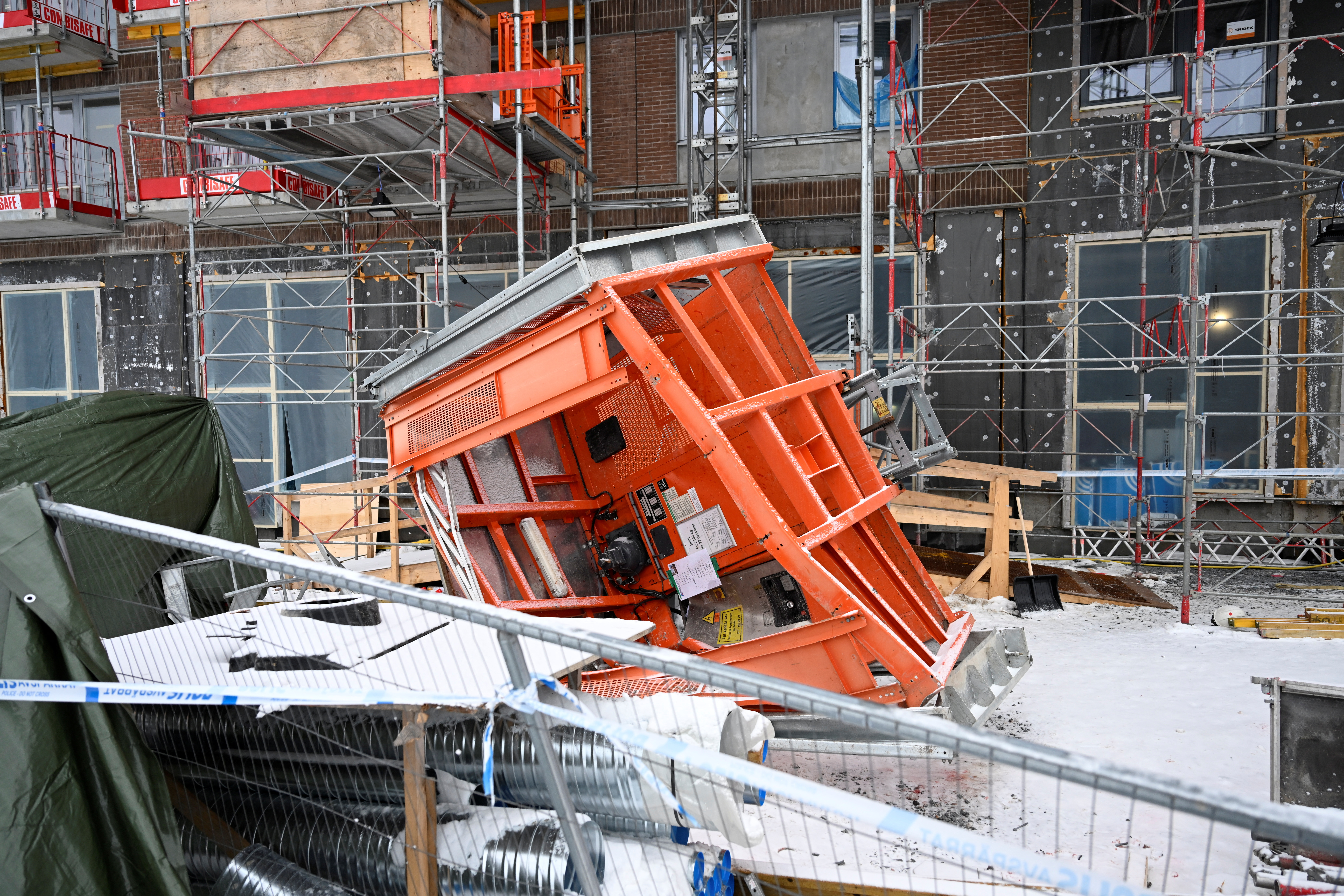 A view shows police tape at the site of a December 11 deadly accident involving an elevator at a construction site on the outskirts of Stockholm, Sweden, December 12, 2023. Fredrik Sandberg