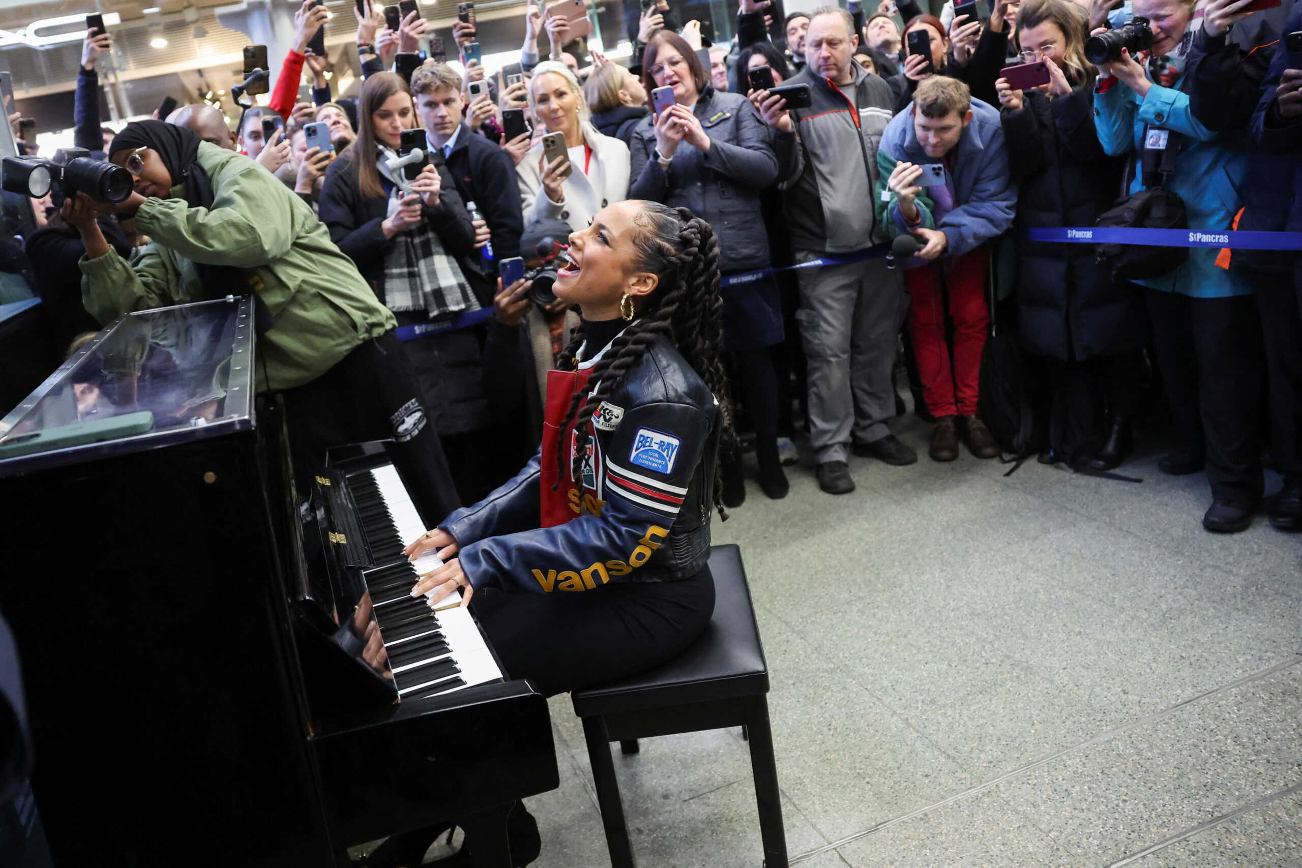 Singer Alicia Keys gives a surprise performance on Elton John's piano at St. Pancras International Station in London, Britain, December 11, 2023. REUTERS